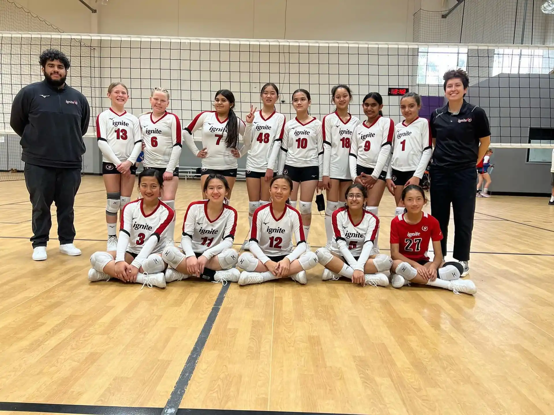 a group of people in sports uniforms