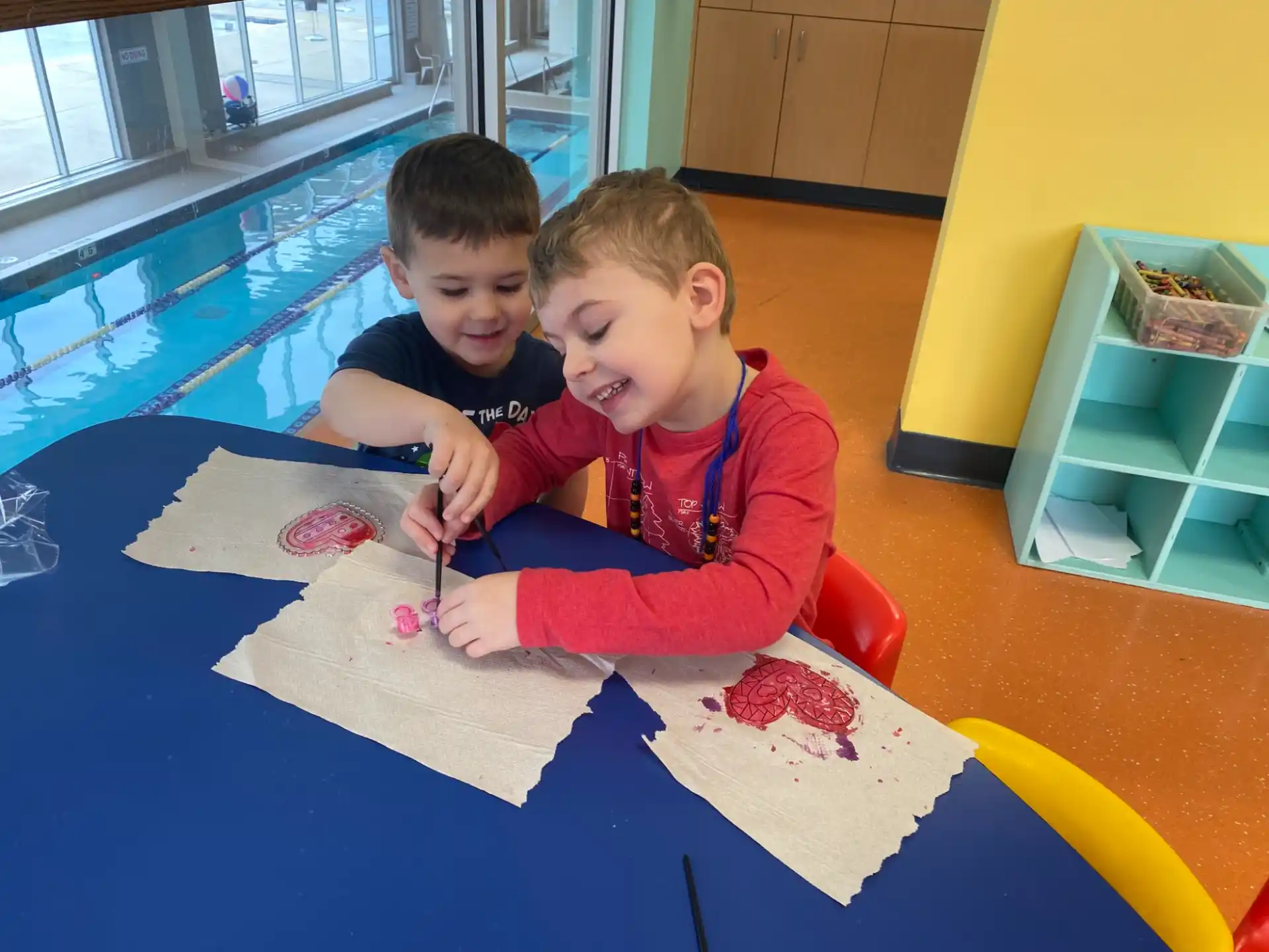 a couple of boys painting