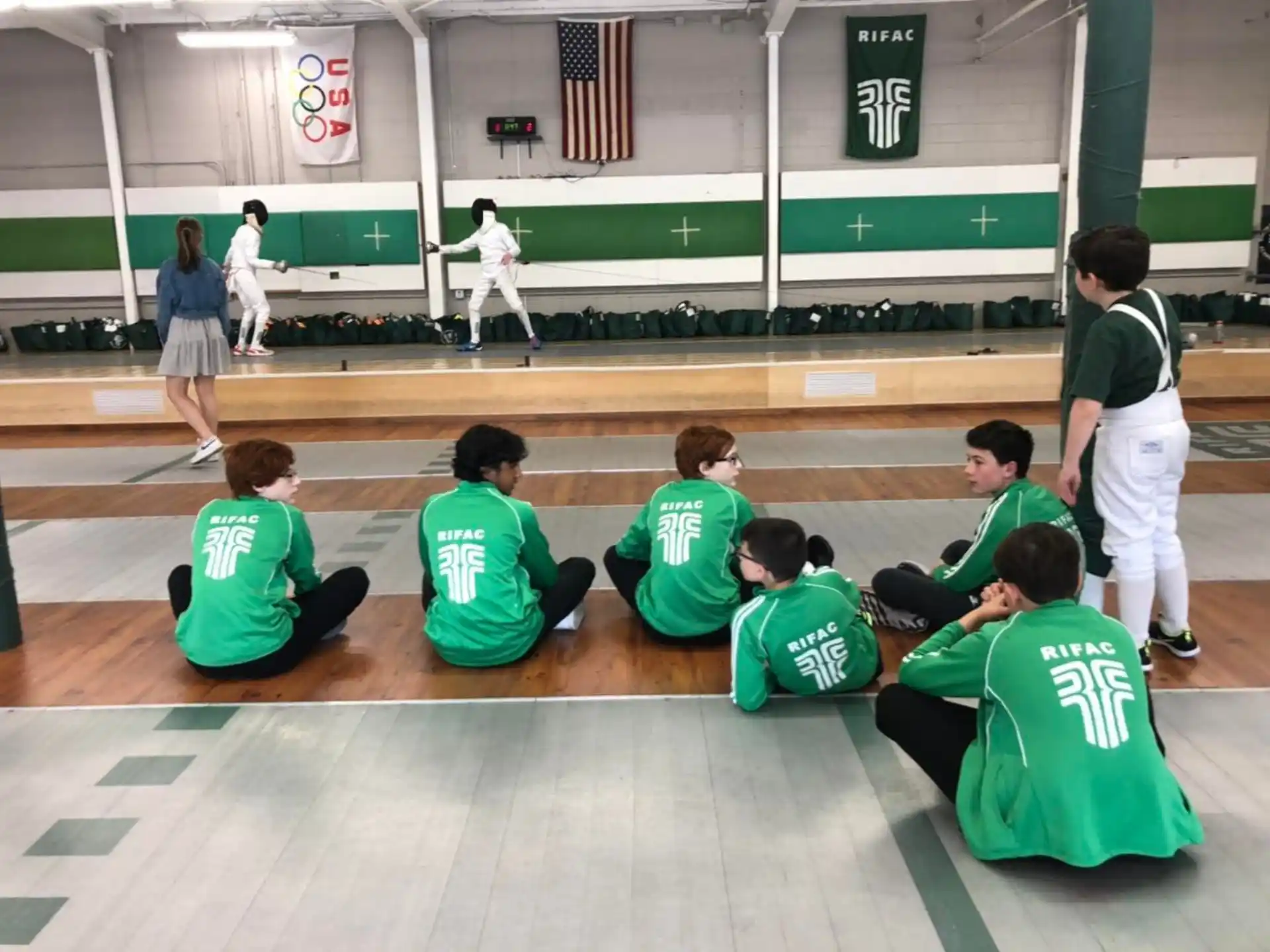 a group of people sitting on the floor