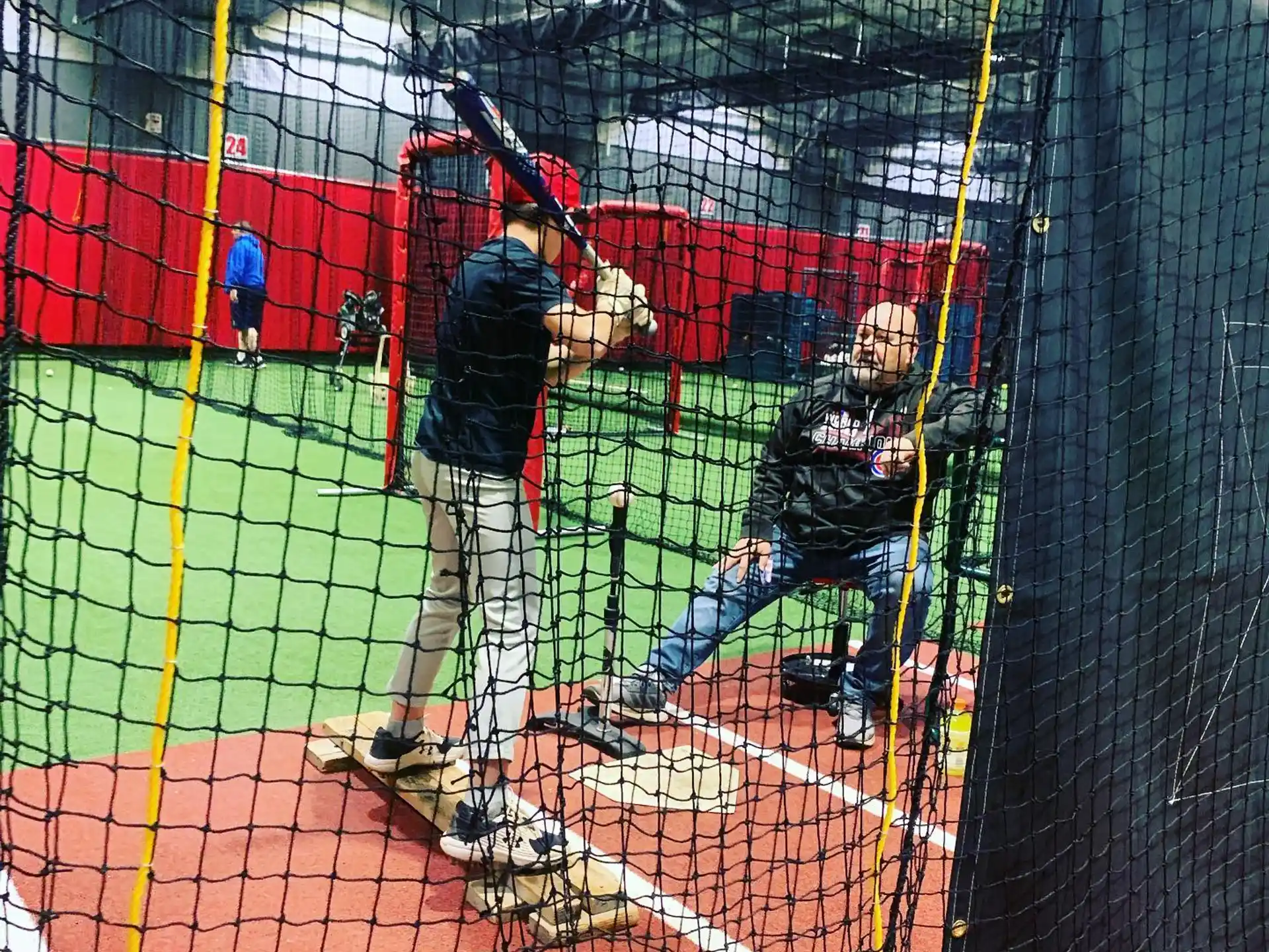a baseball player prepares to swing a bat