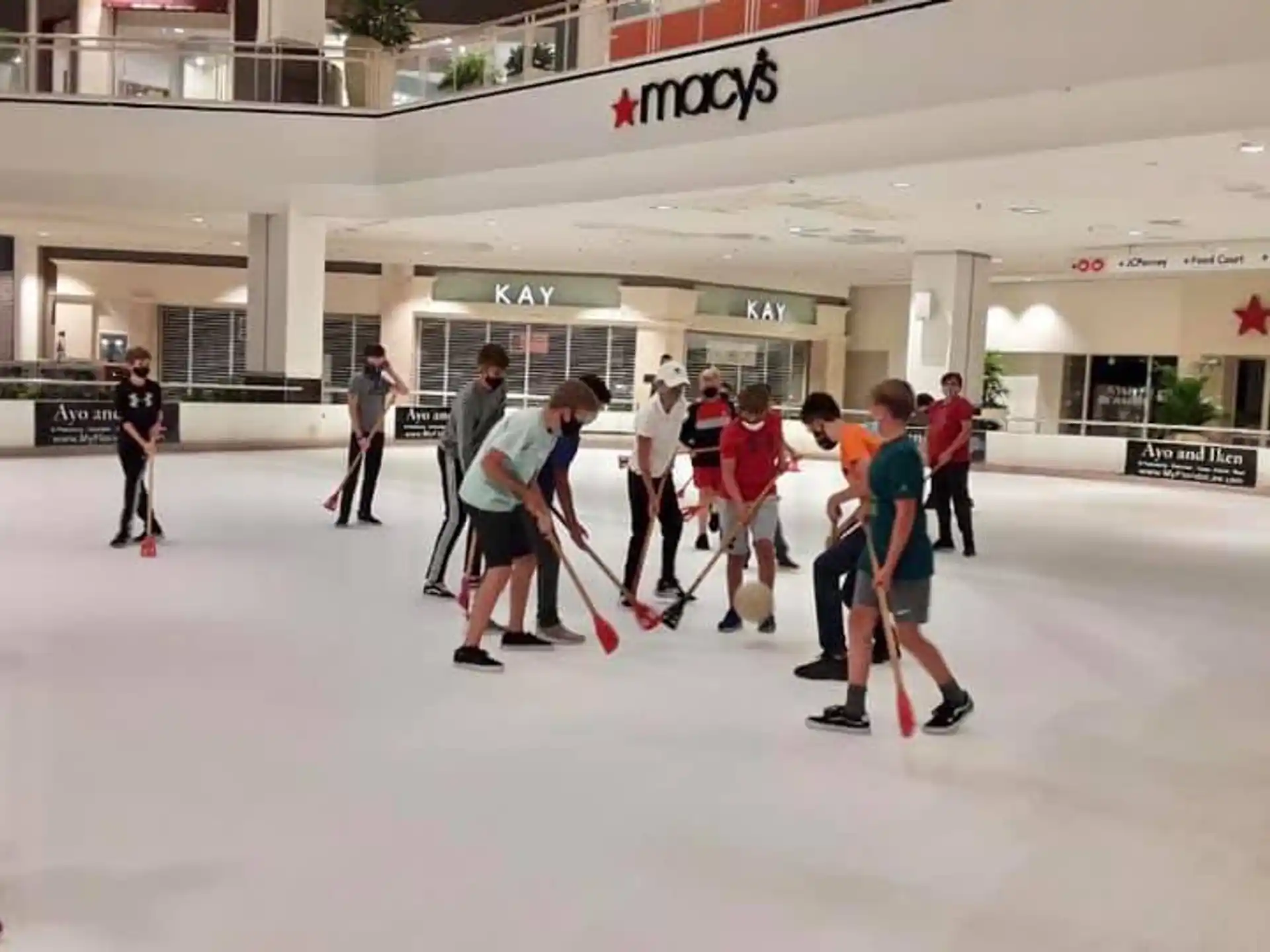 a group of people playing hockey