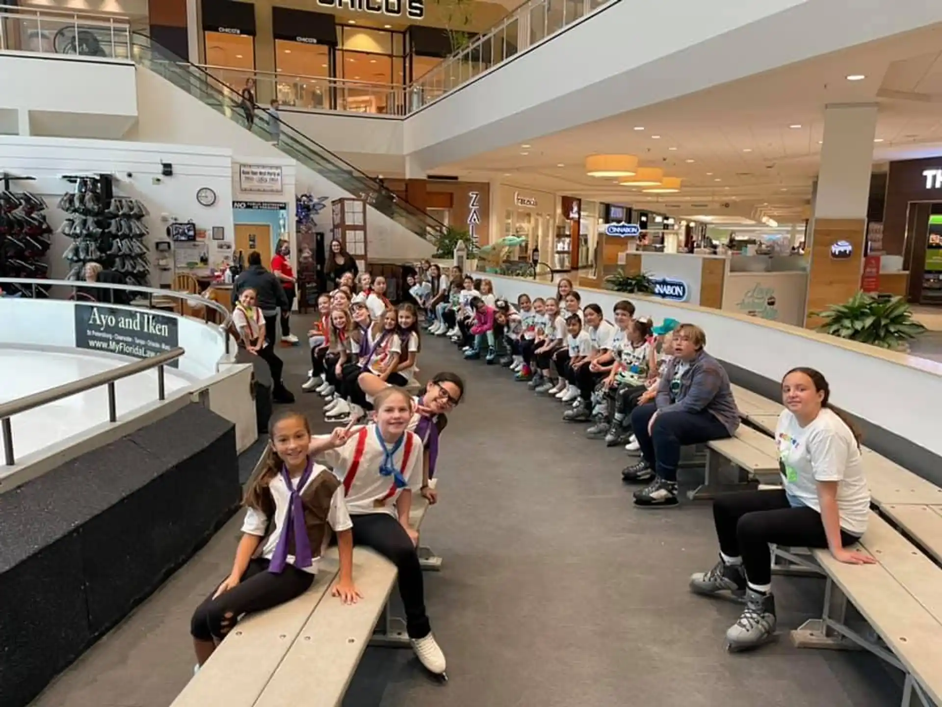 a group of people sitting on benches