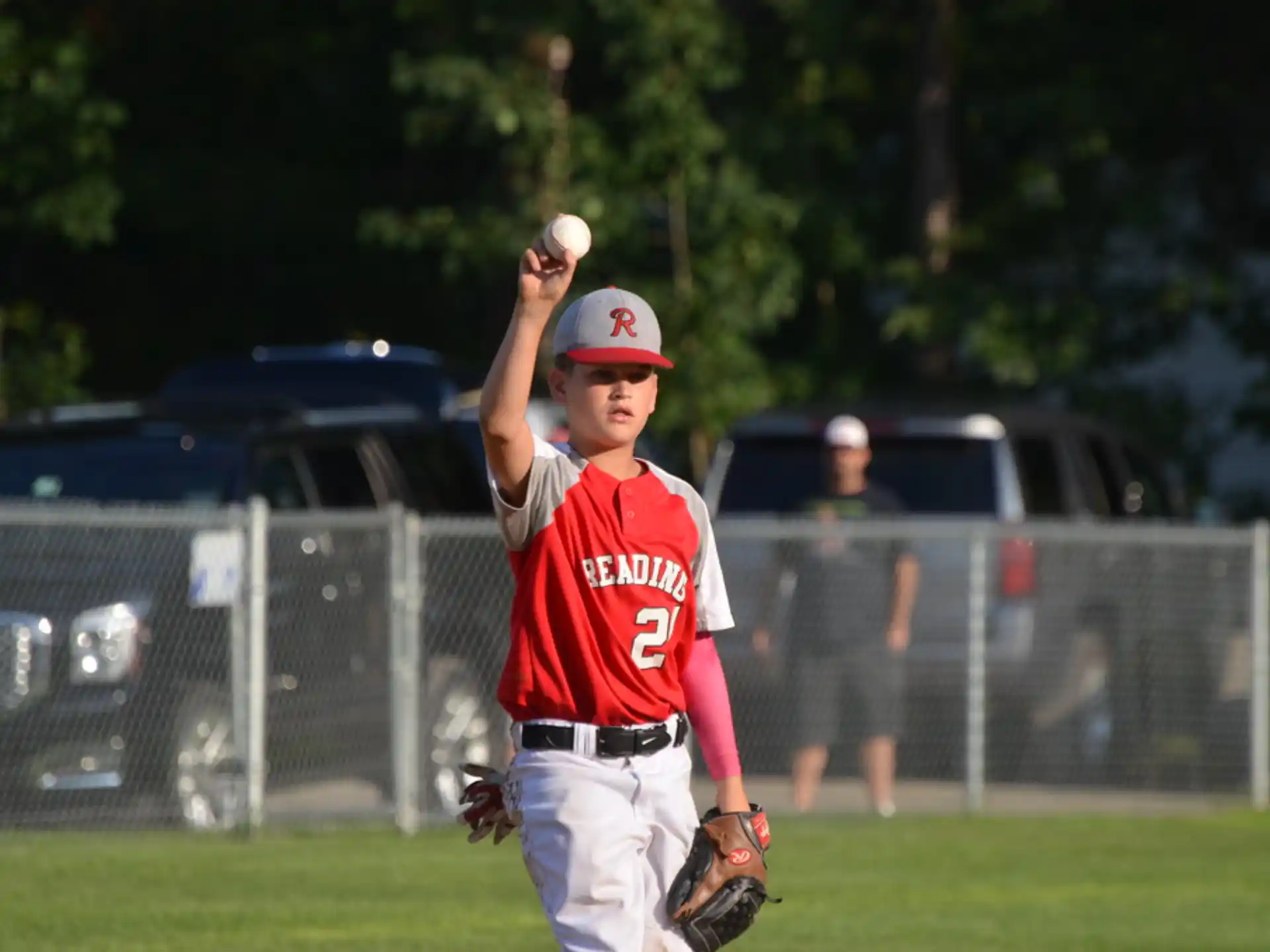 a kid throwing a baseball