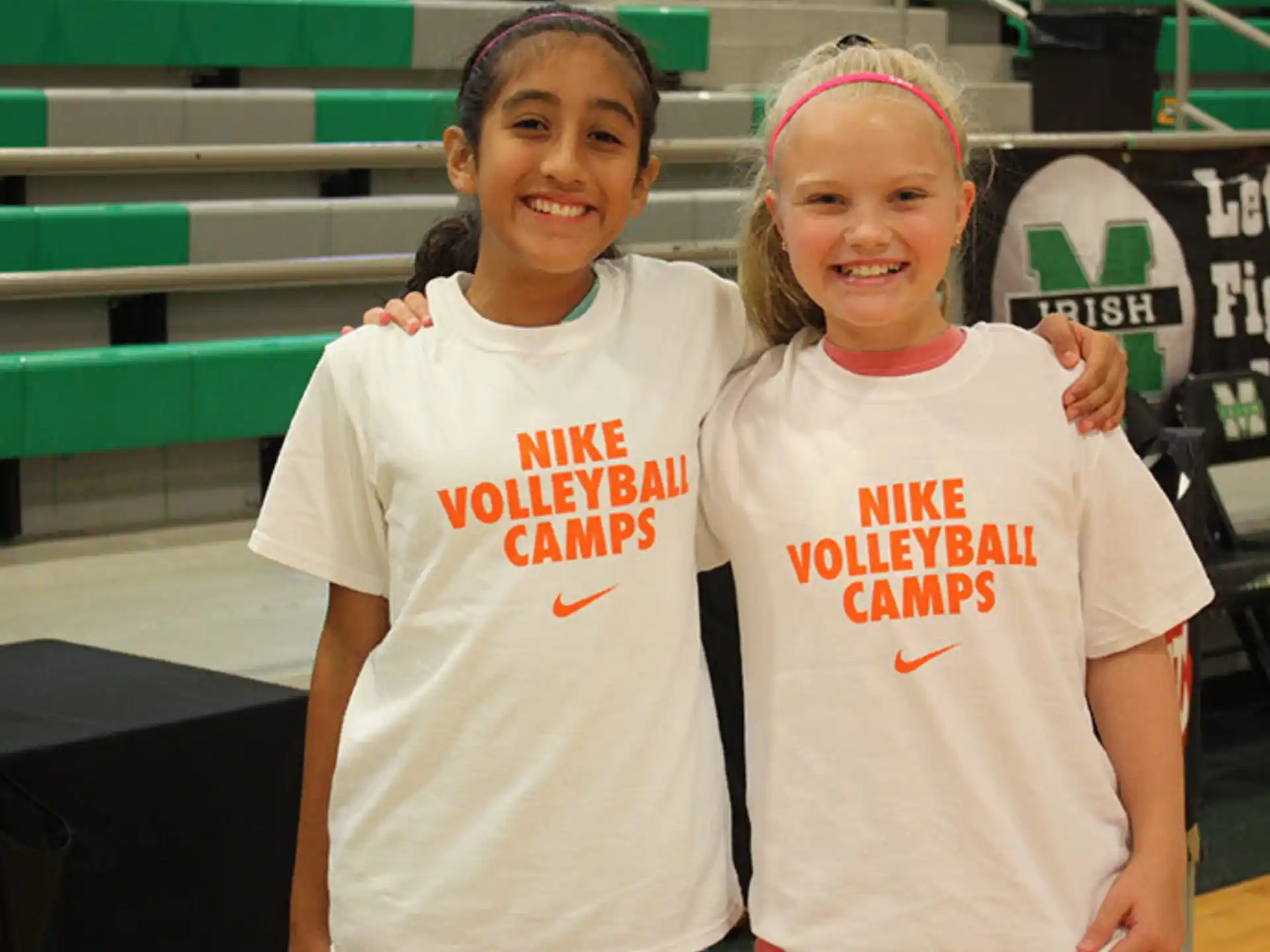 two girls wearing white shirts
