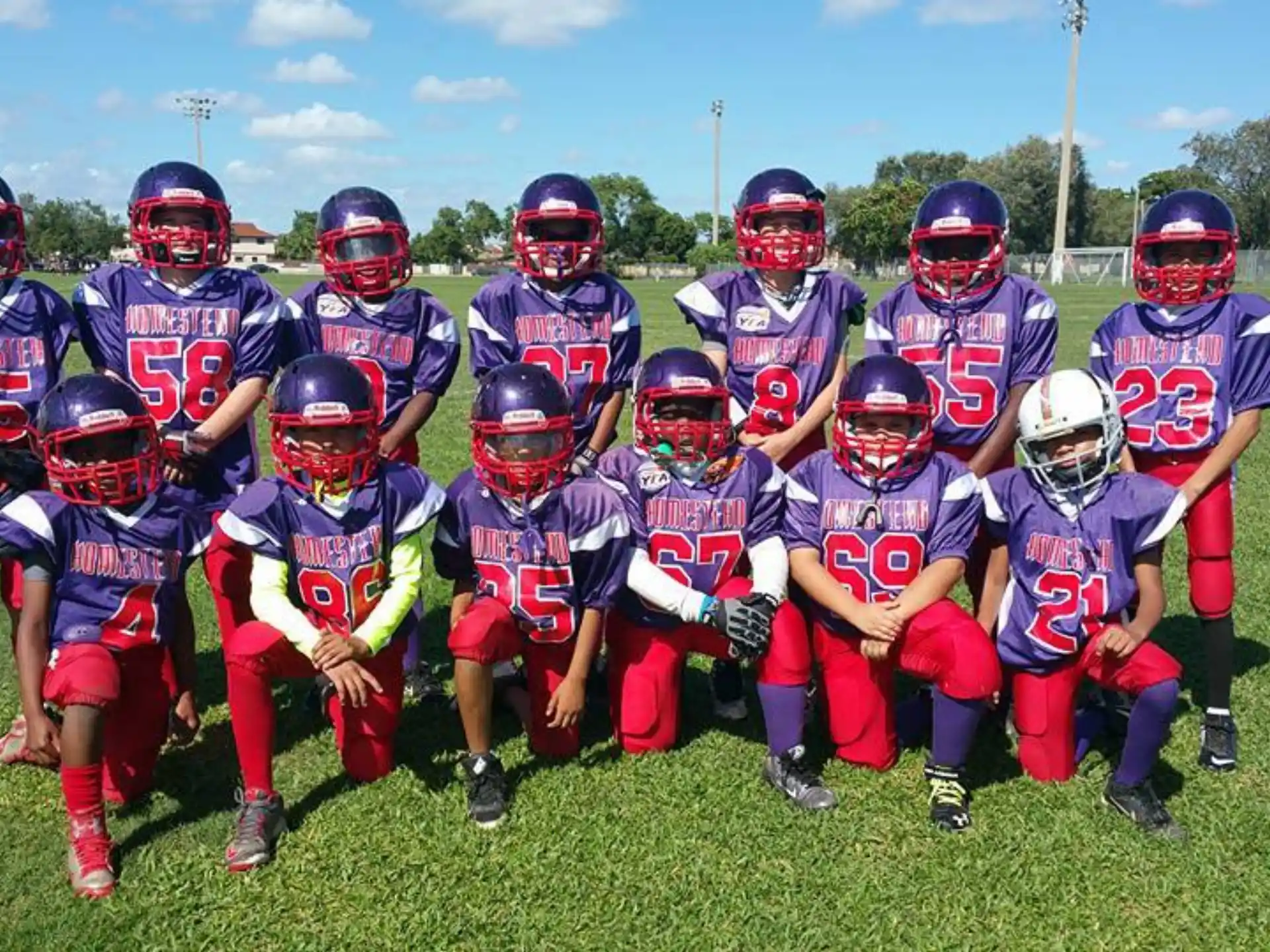 a group of kids wearing football gear