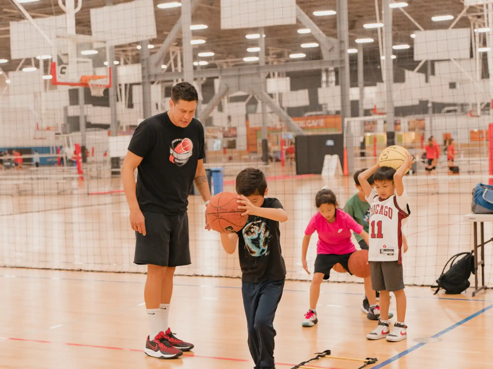 a person and kids playing basketball