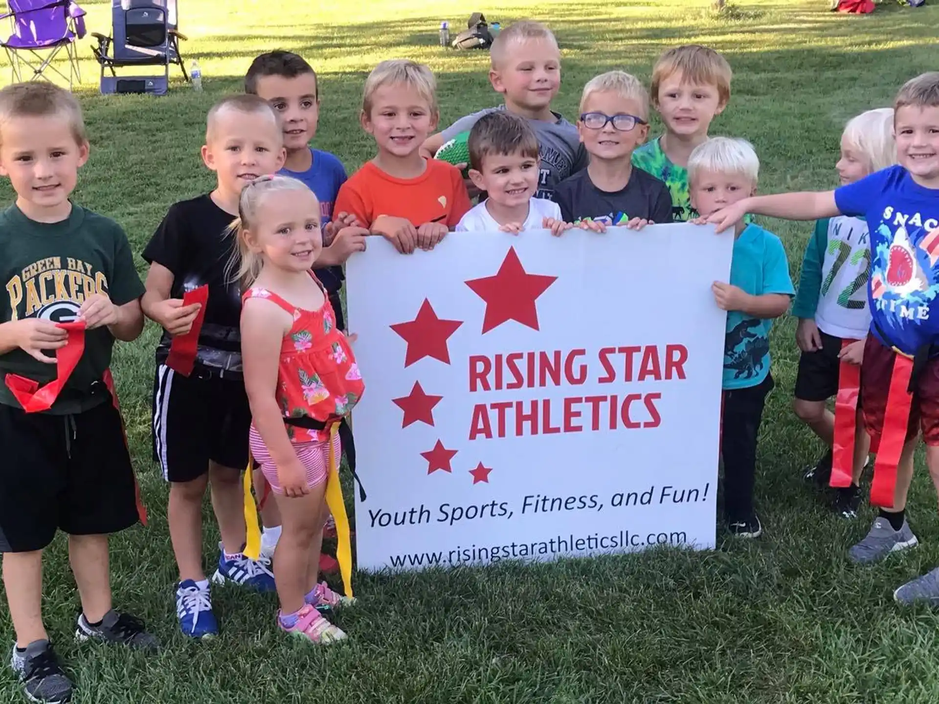 a group of children holding a sign