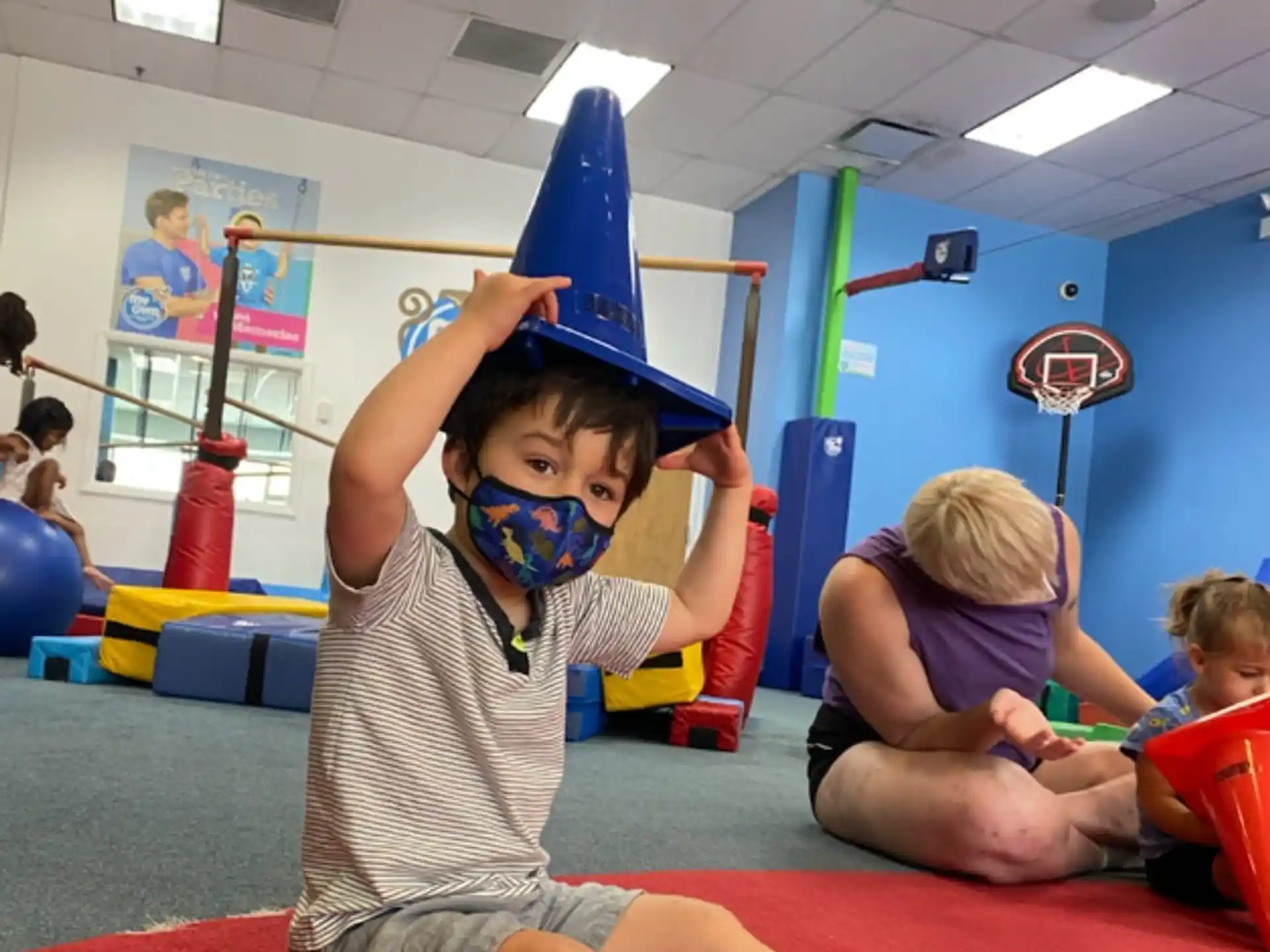 a boy wearing a blue hat