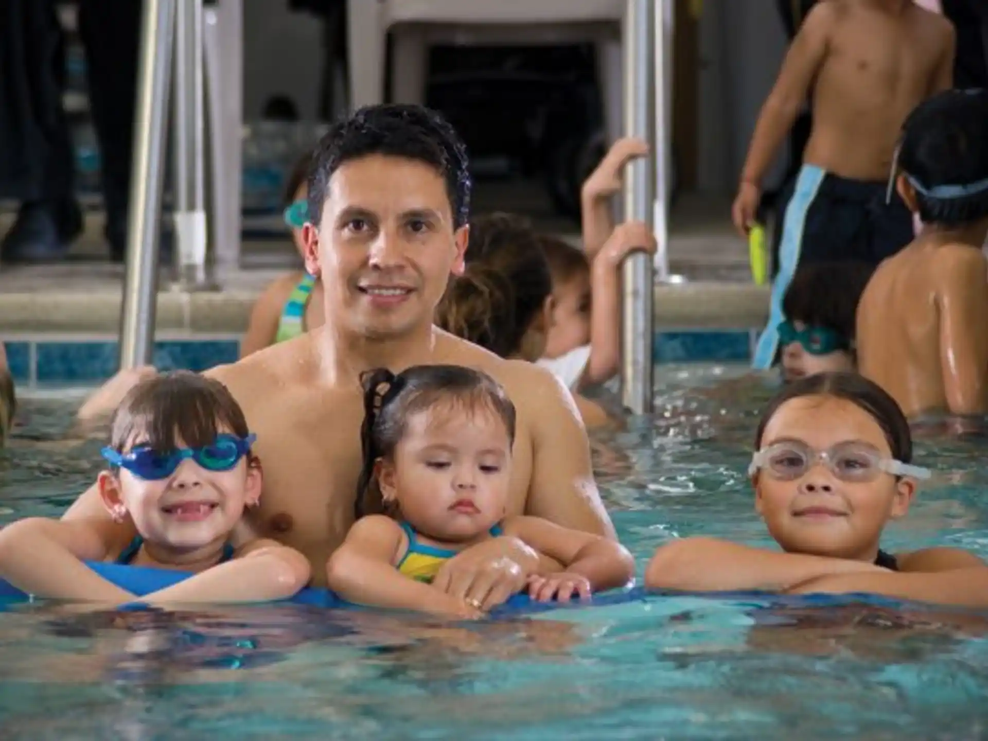 a group of kids in a pool