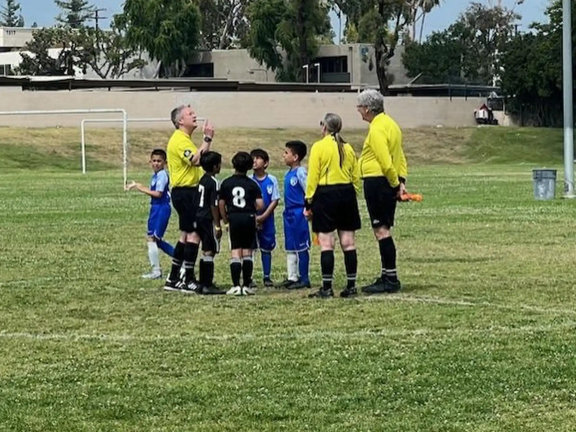 a group of people standing on a field