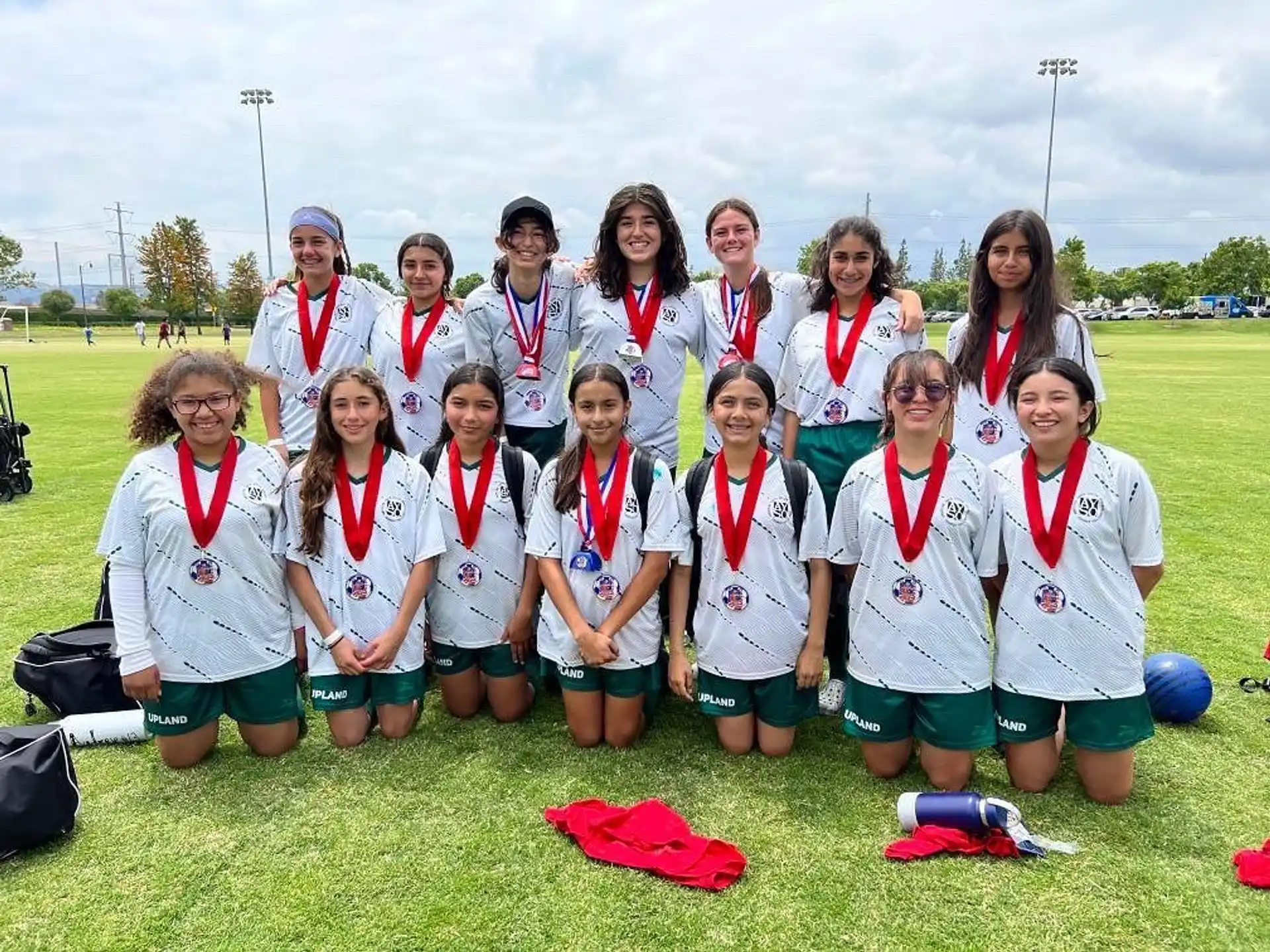 a group of people wearing medals