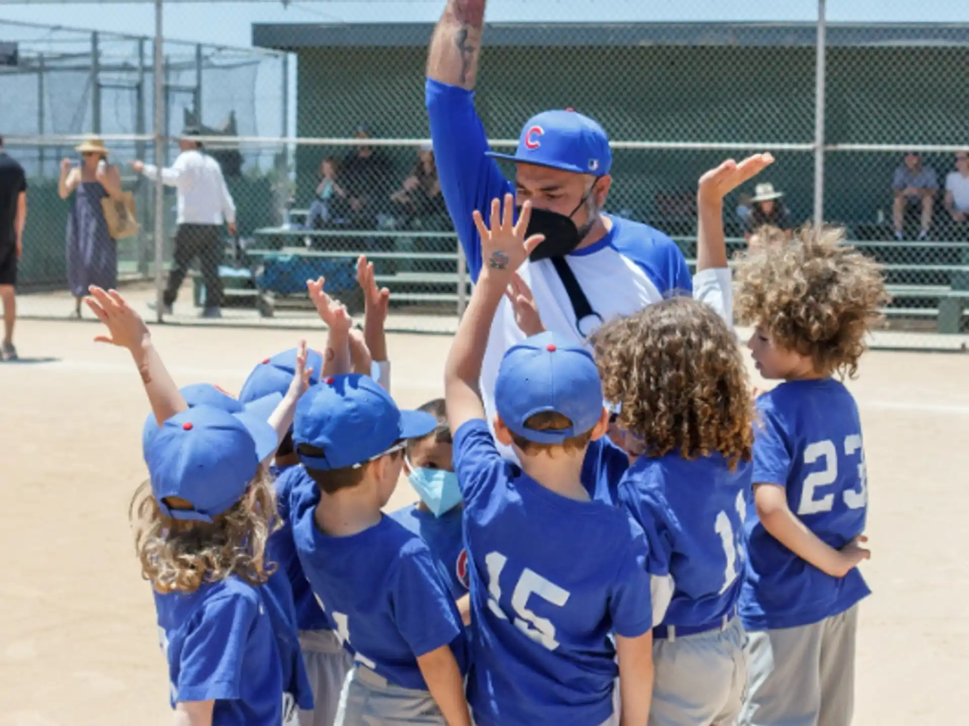 a group of kids in blue shirts