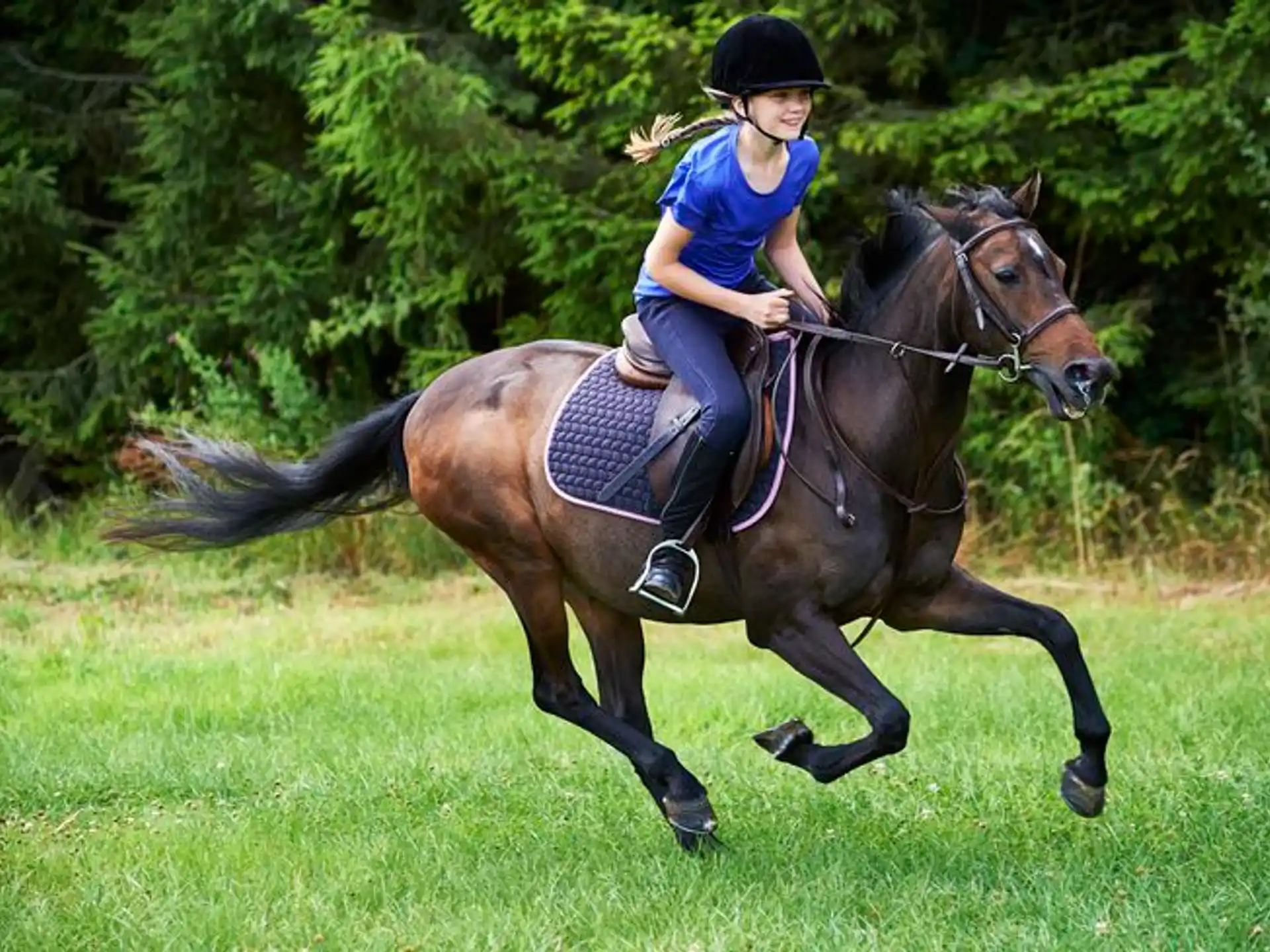 a girl riding a horse