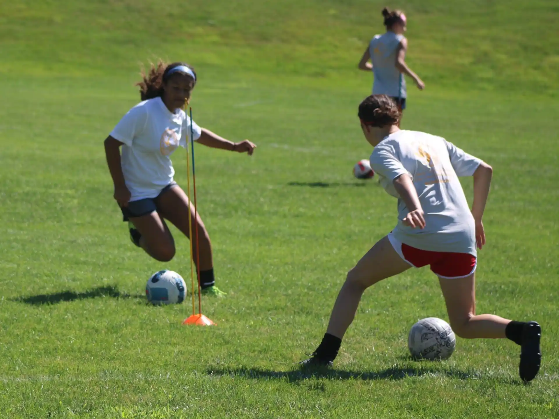 a group of girls playing football
