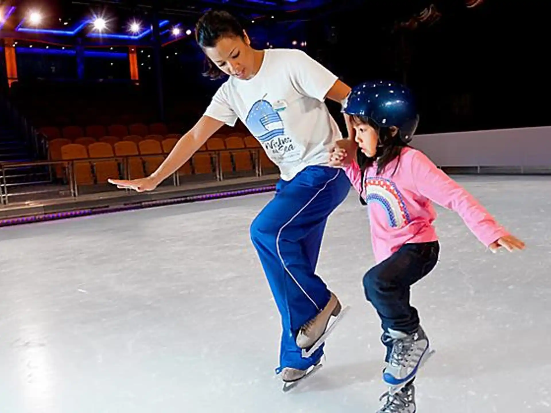 a man and a girl ice skating