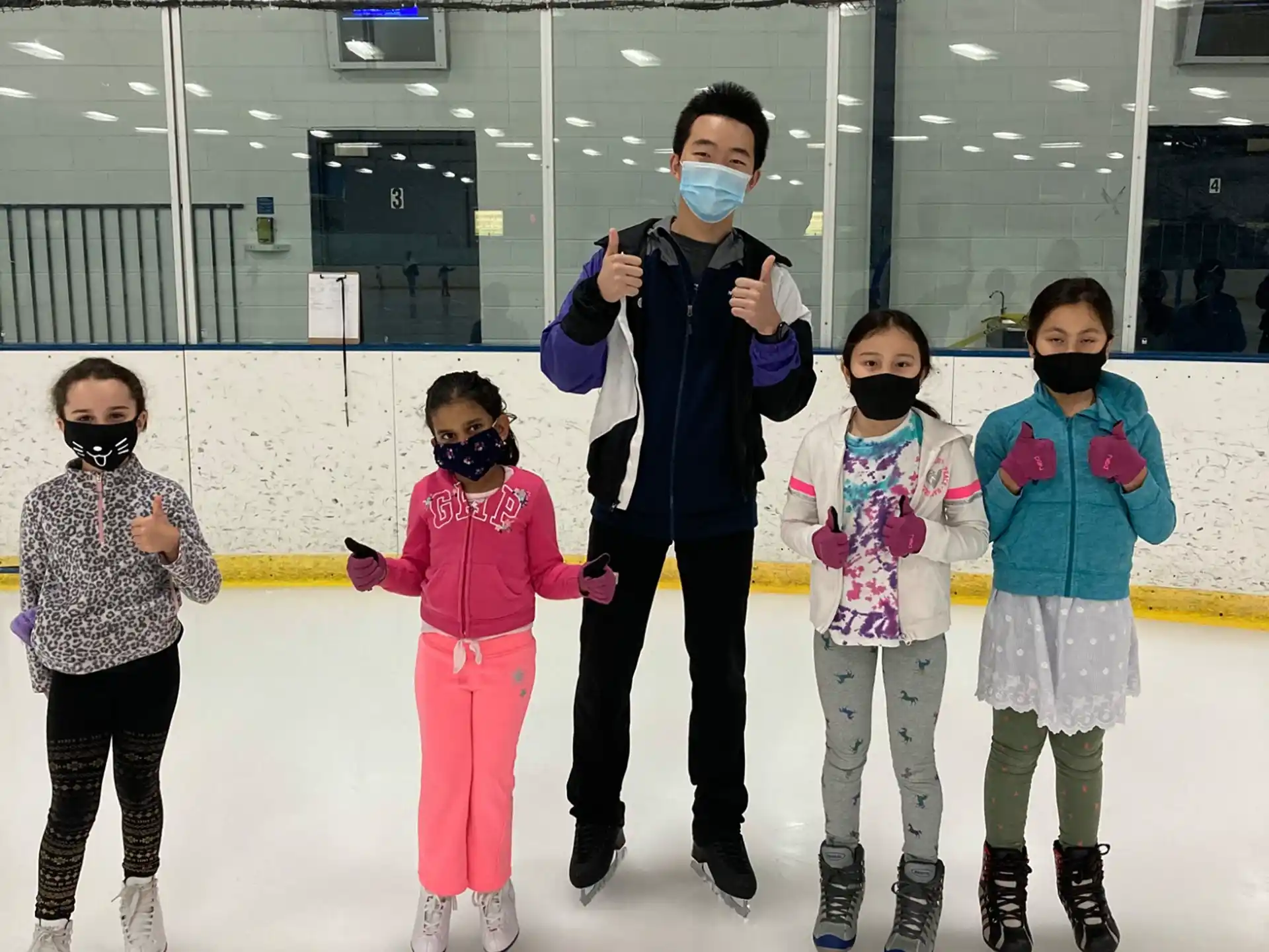 a person on ice skates with kids
