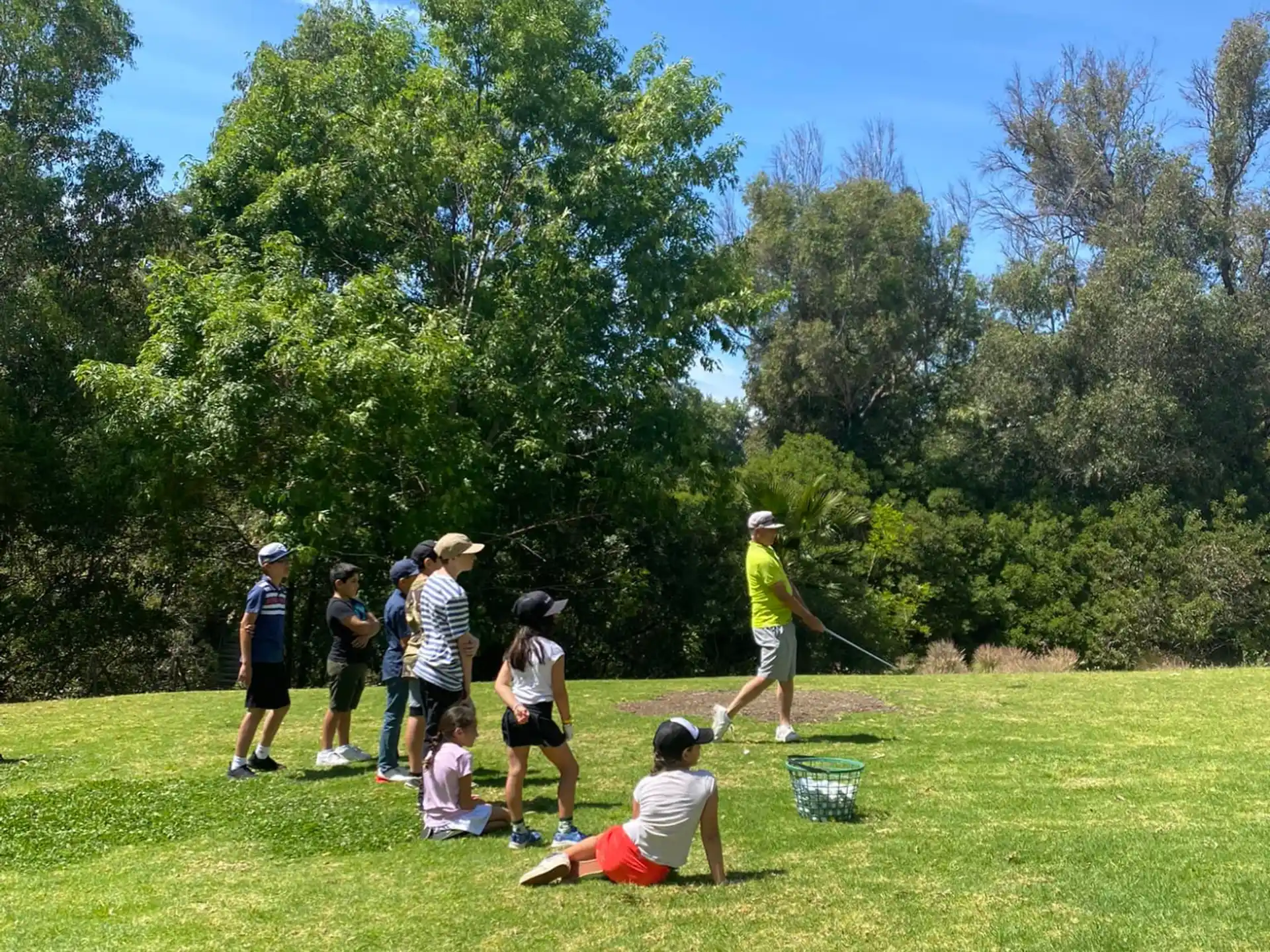 a group of people playing baseball