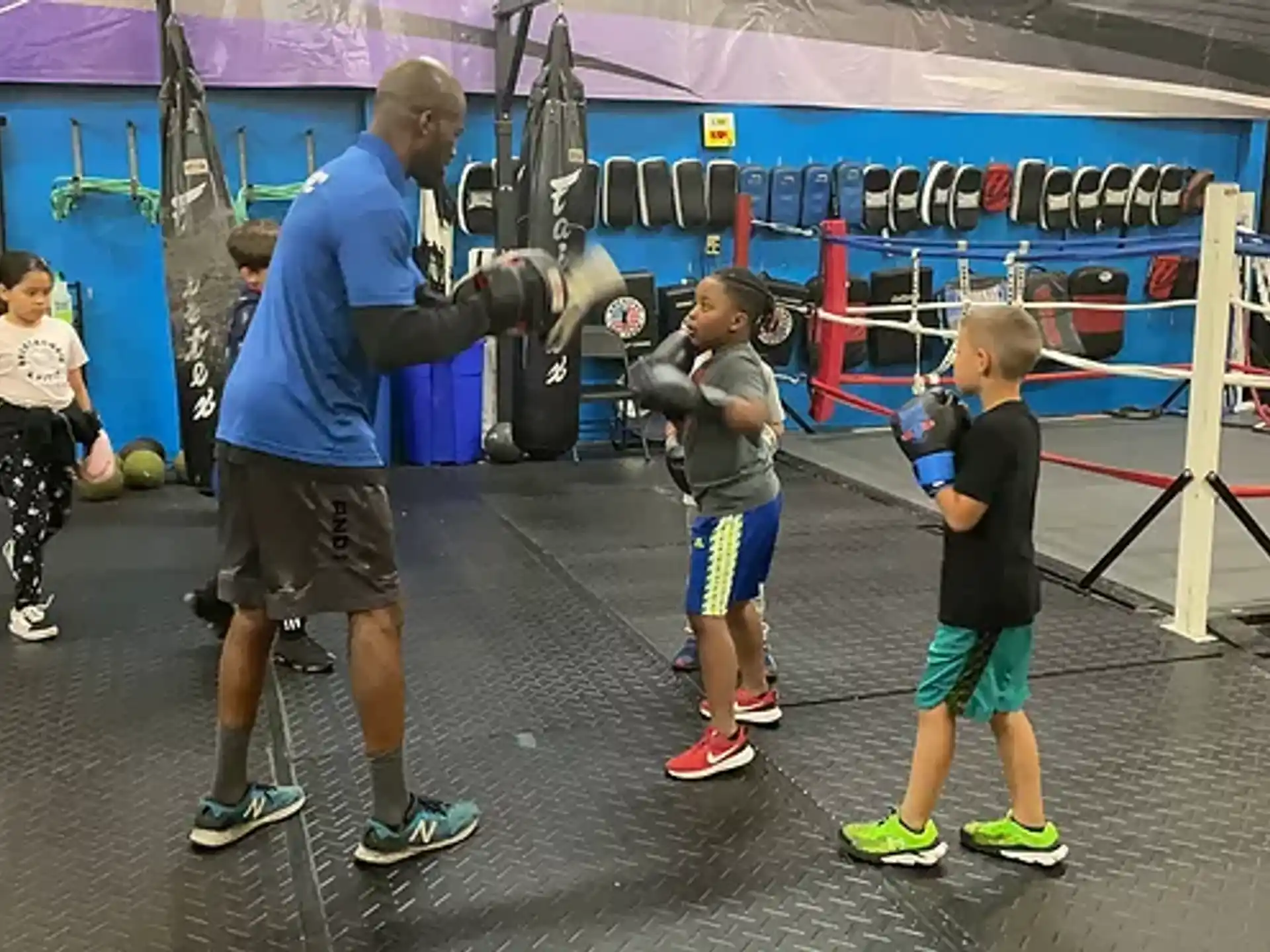 a person and kids in a gym