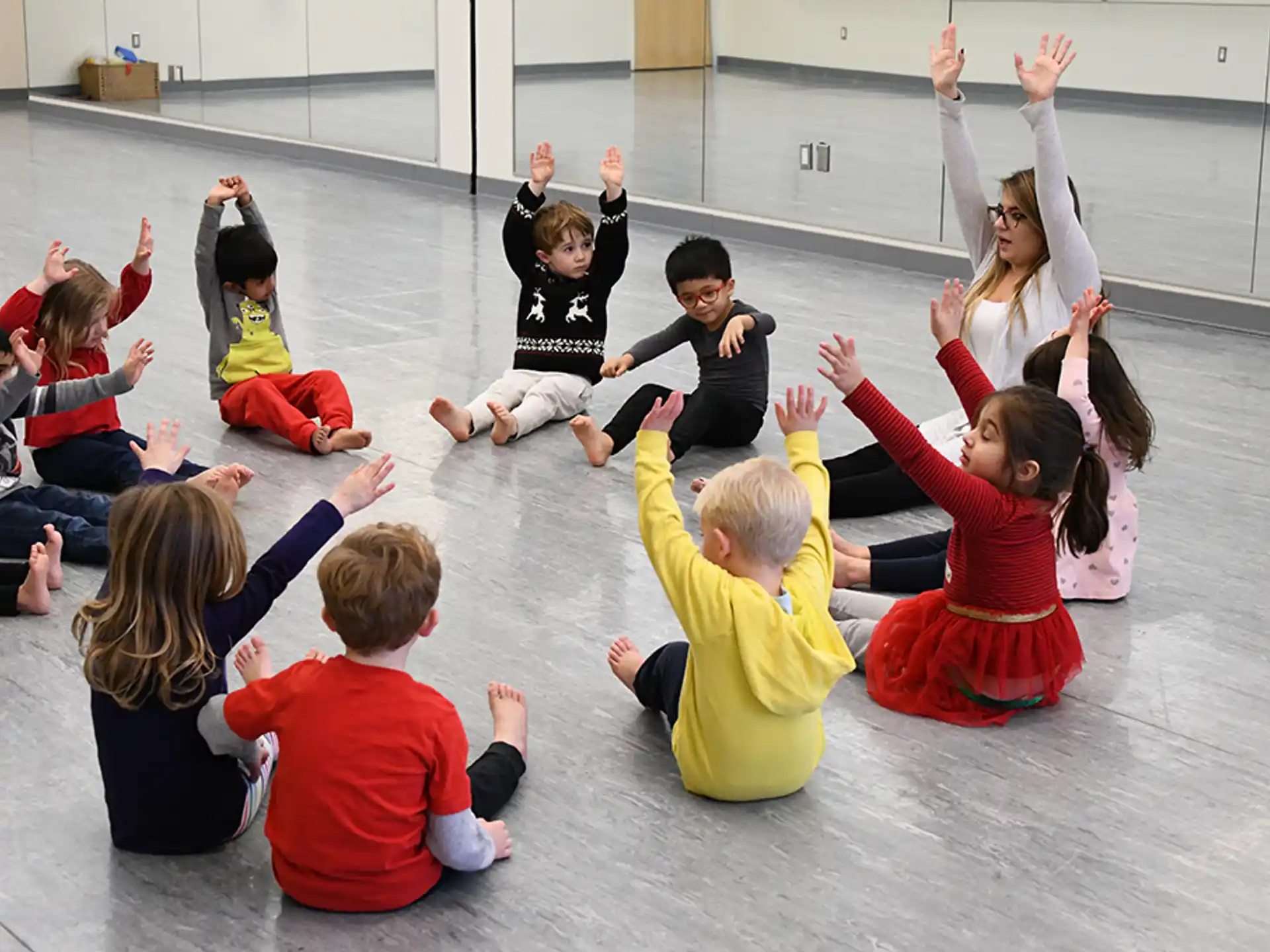 a group of children sitting on the floor