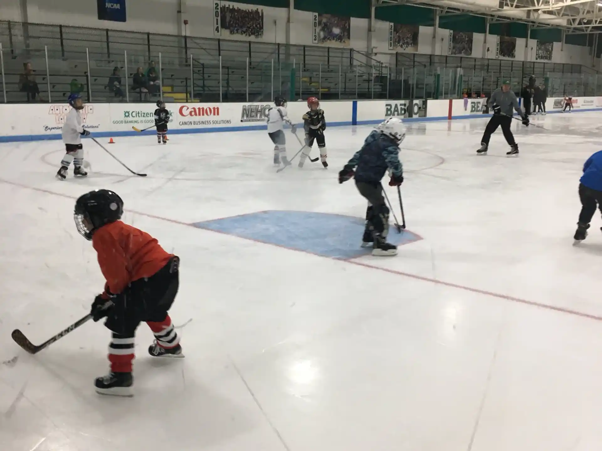 a group of people playing hockey