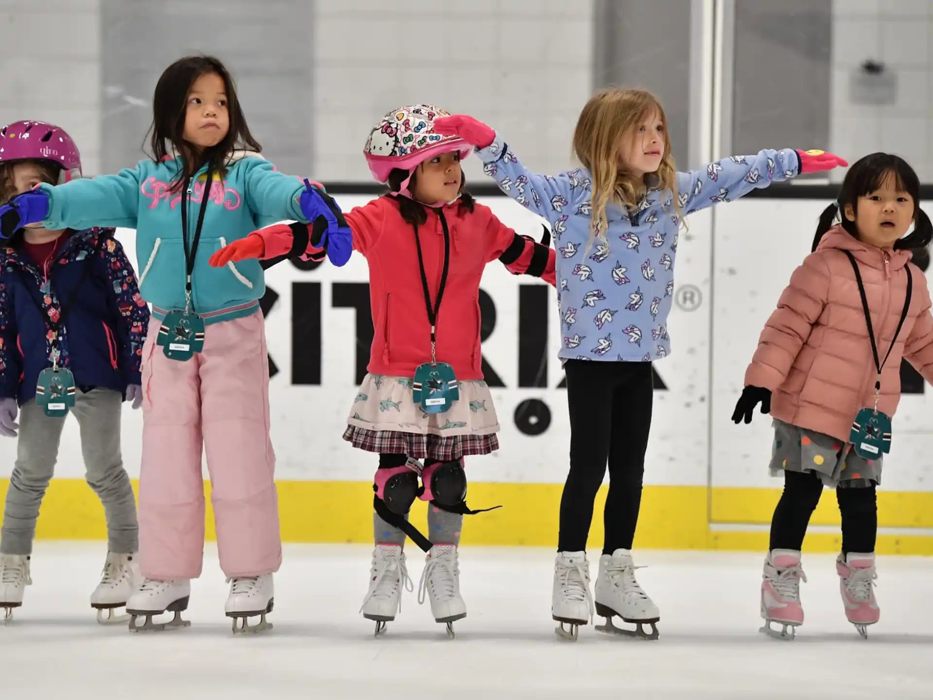a group of girls on ice skates