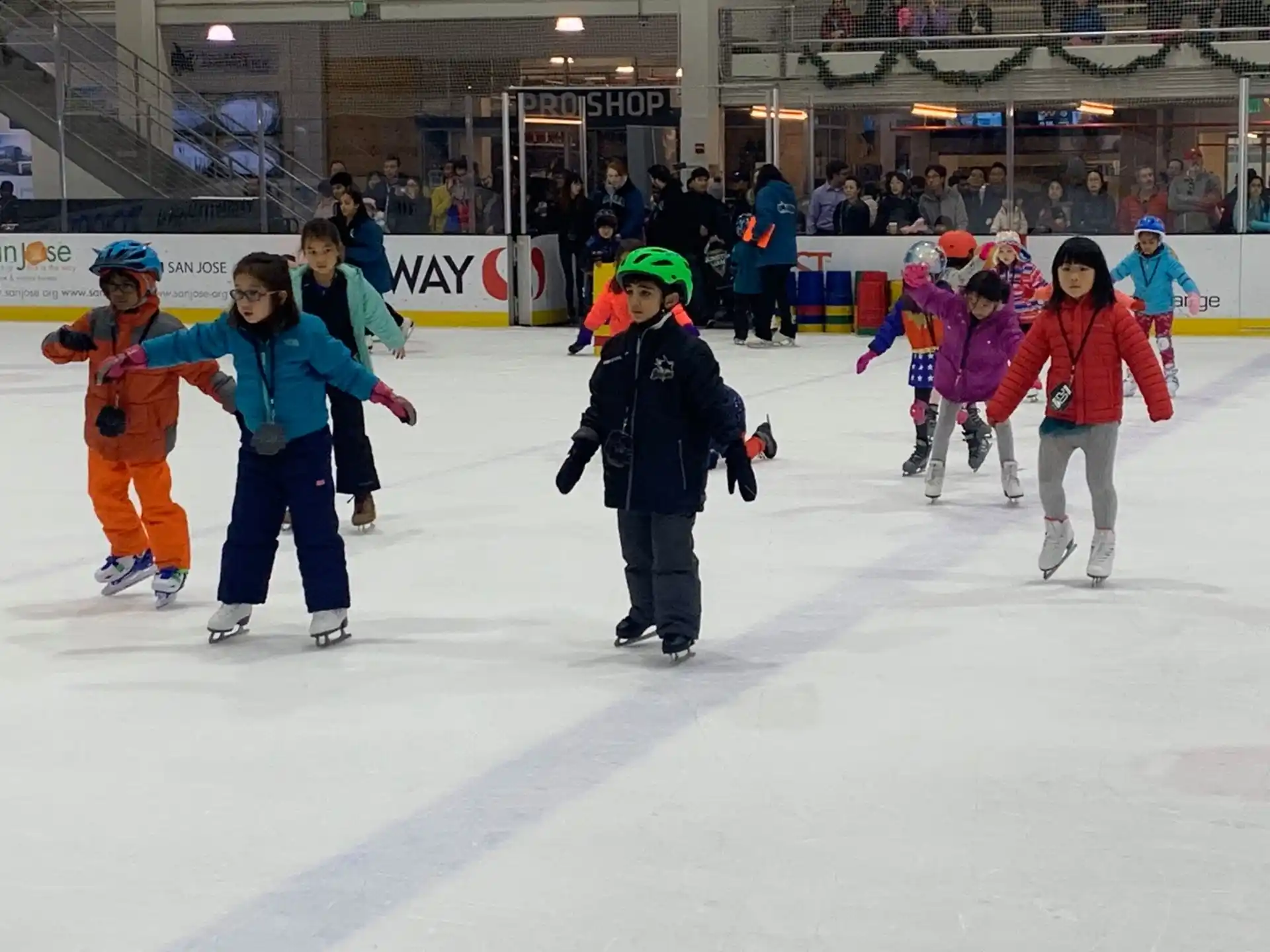 a group of people ice skating