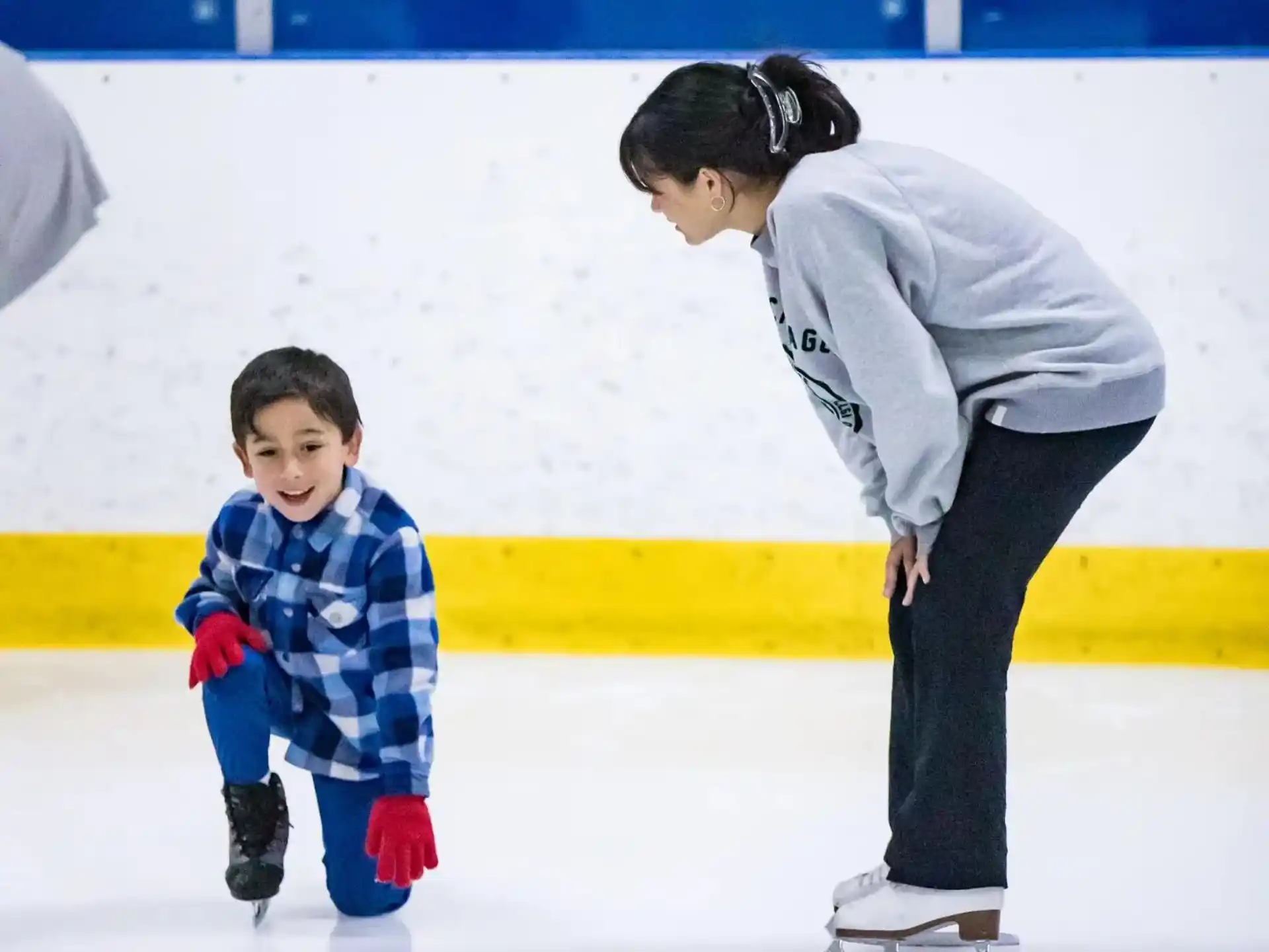 a man and a child ice skating