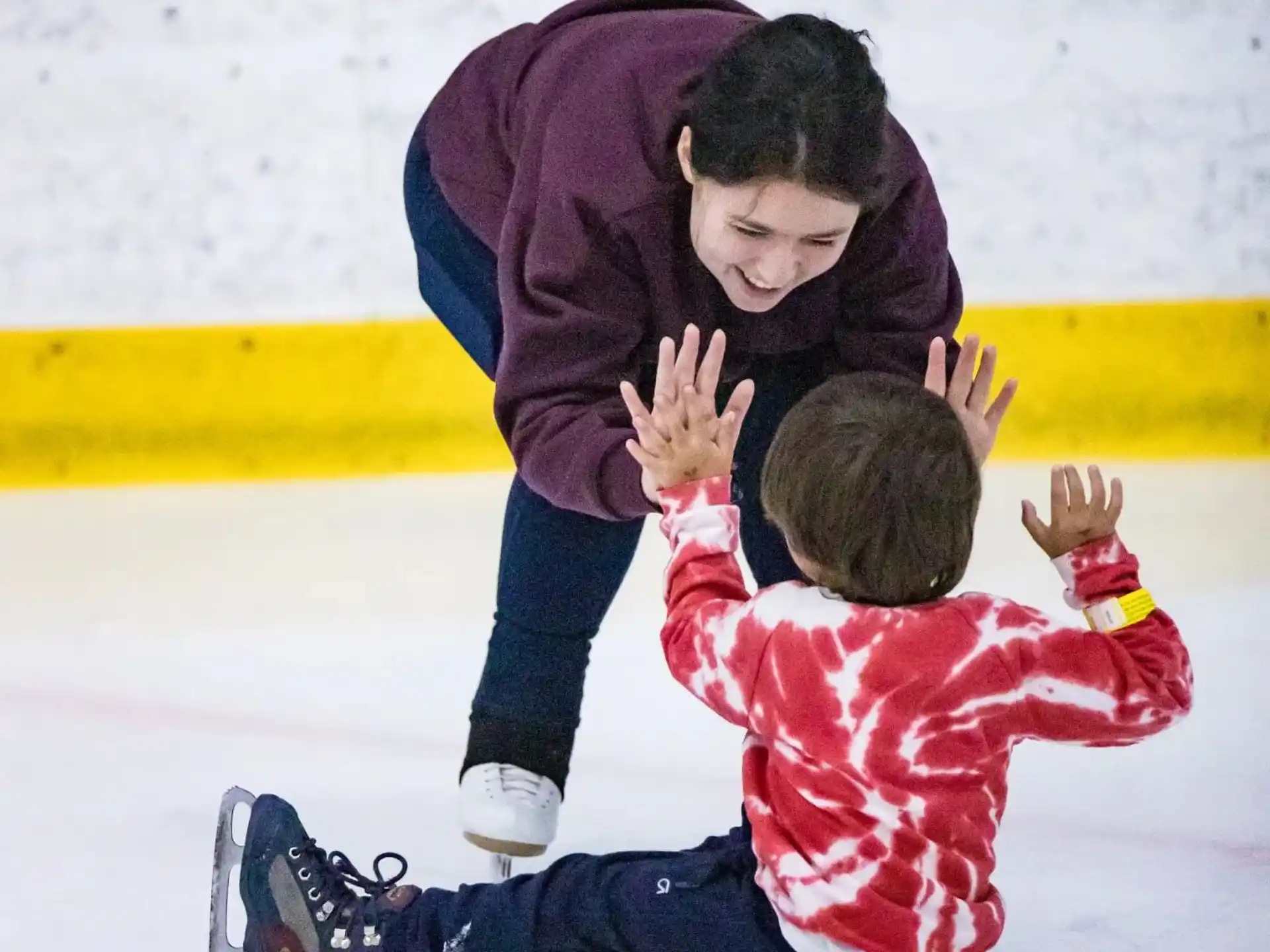 a person and a child on ice