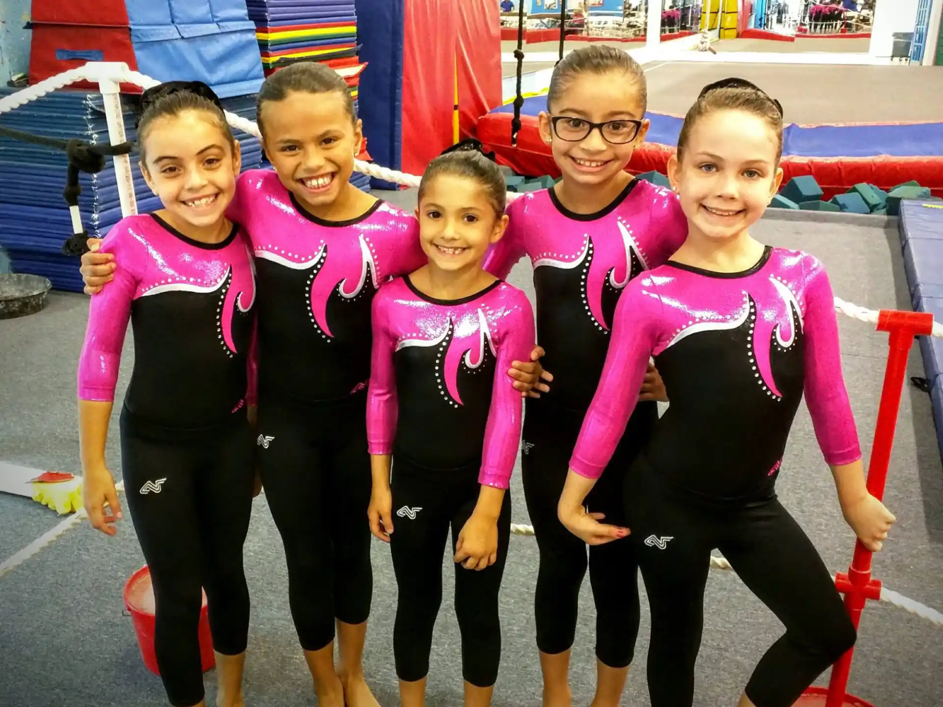 a group of children wearing matching outfits
