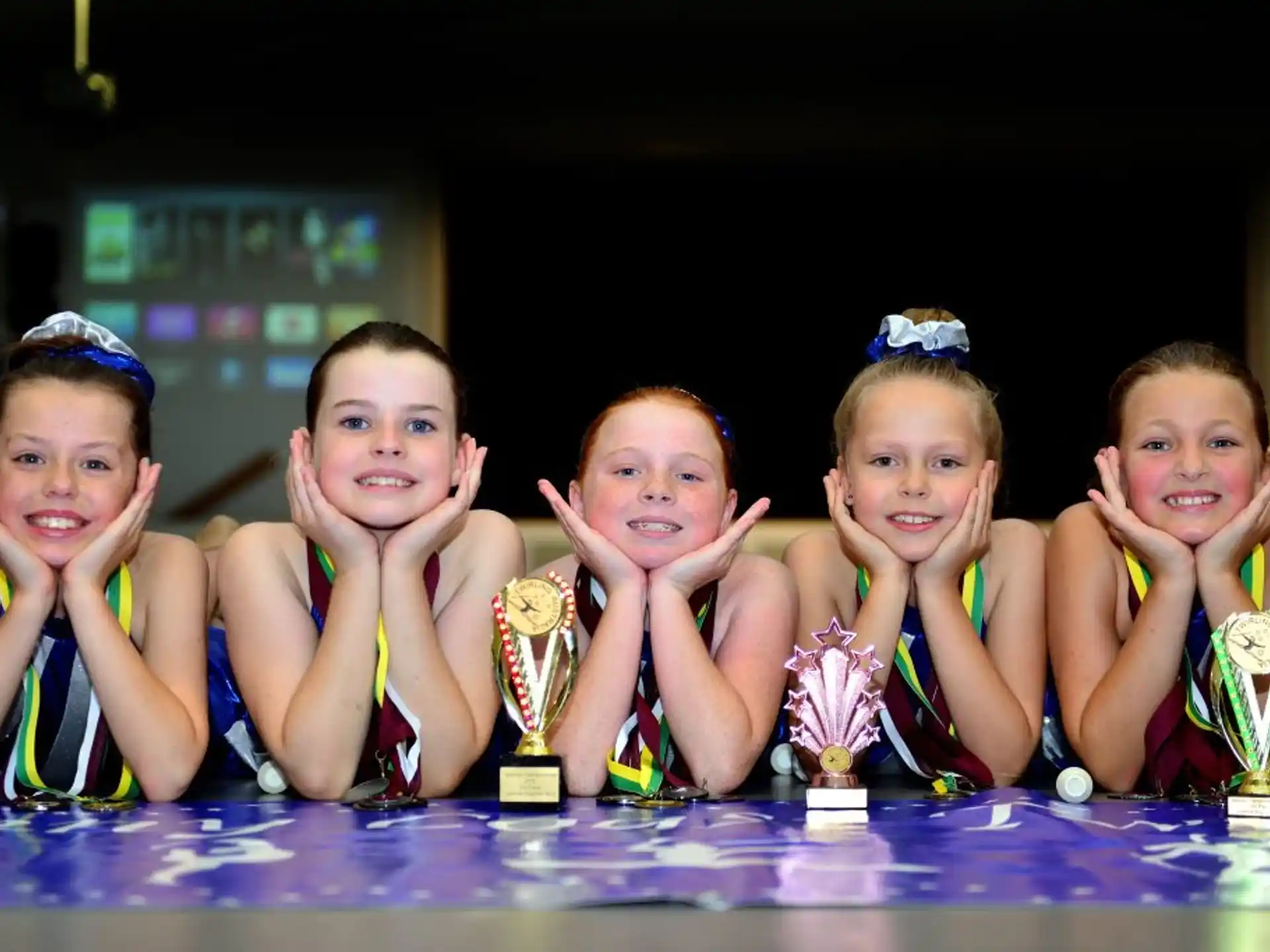 a group of children wearing matching outfits