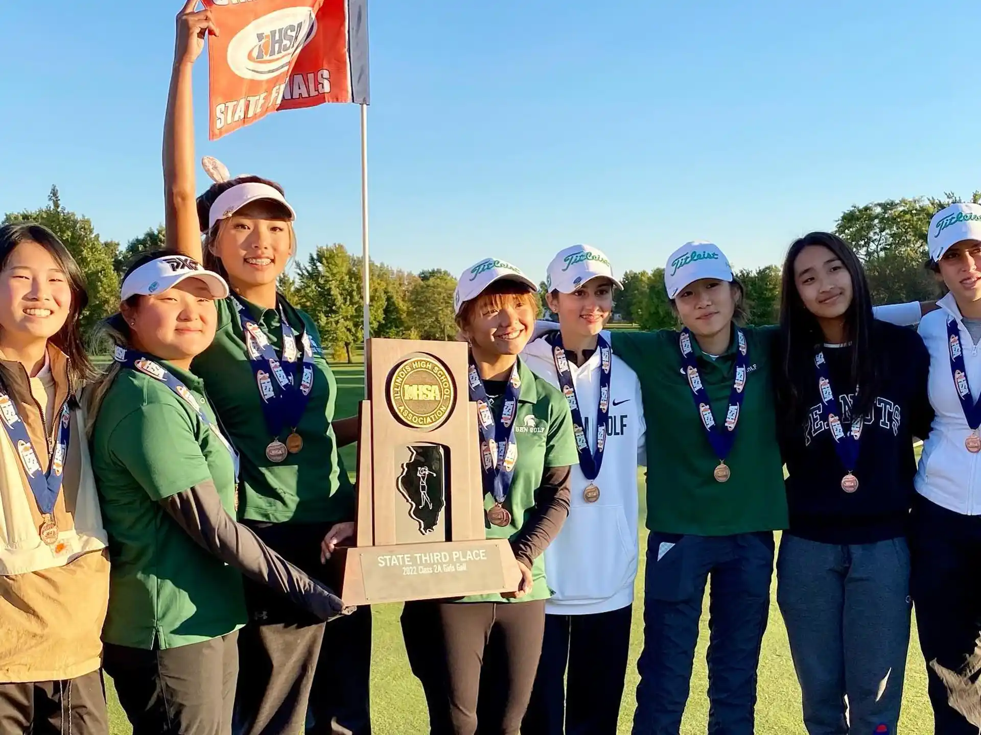 a group of people holding a plaque