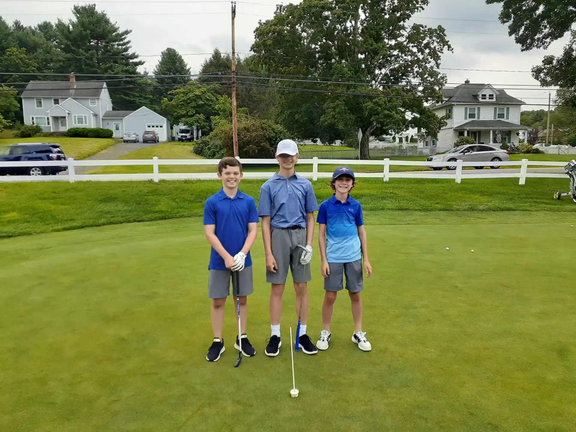 a group of people on a golf course