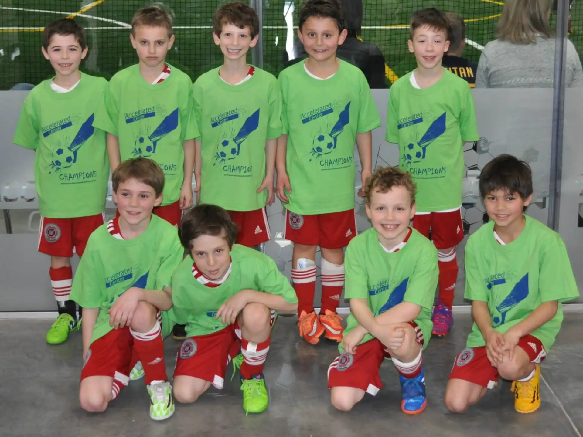a group of kids in green uniforms
