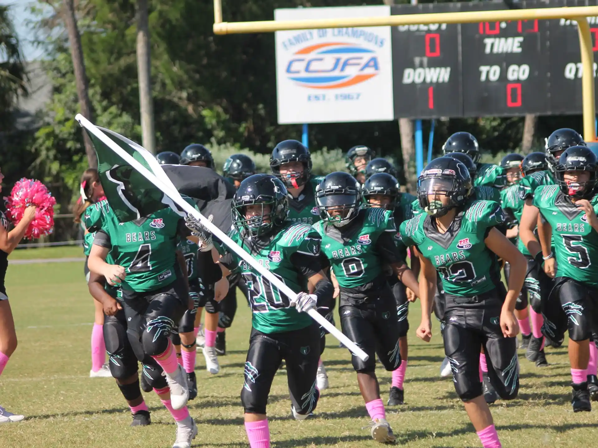 a group of people playing lacrosse
