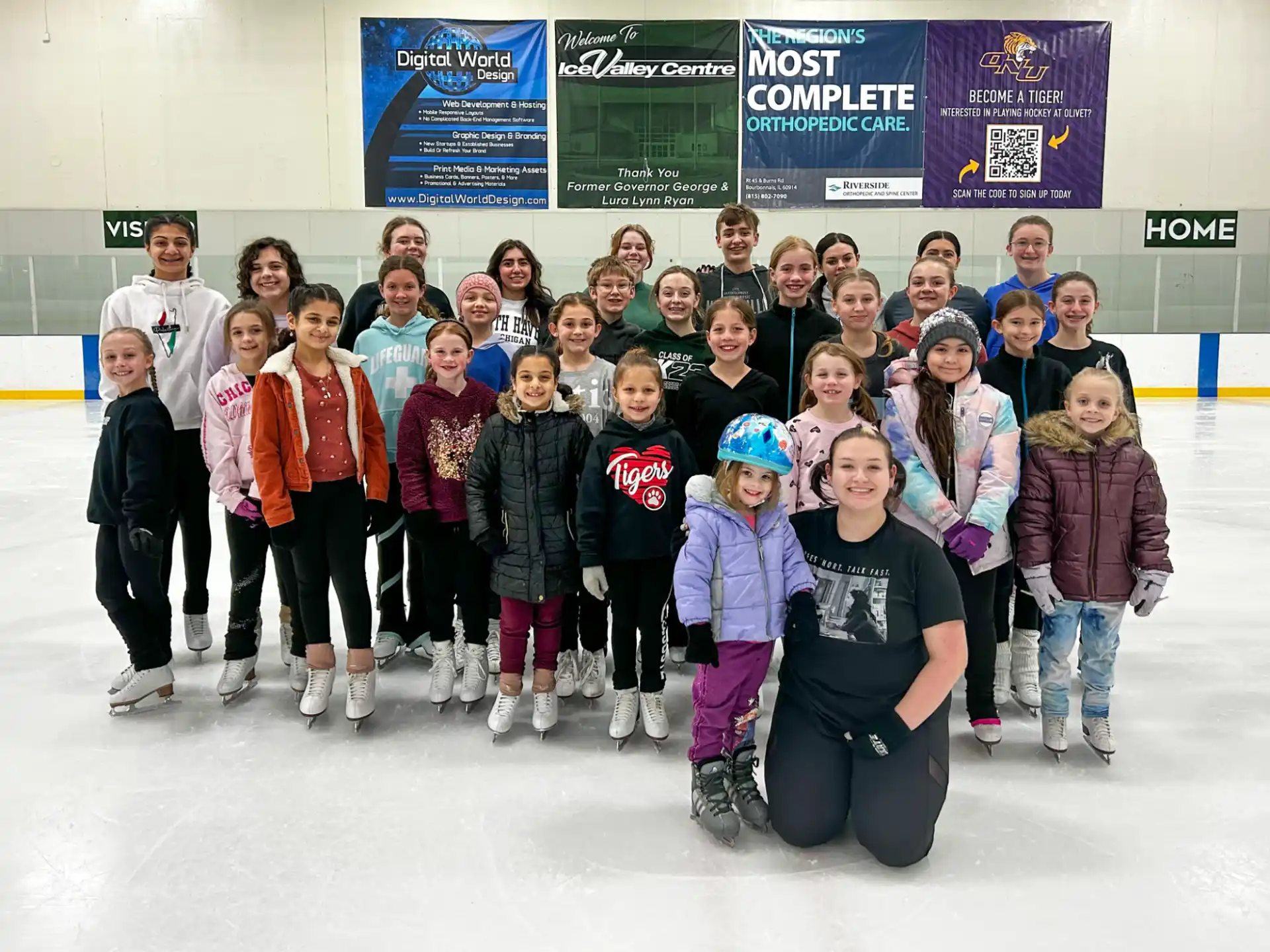 a group of people posing for a photo on ice