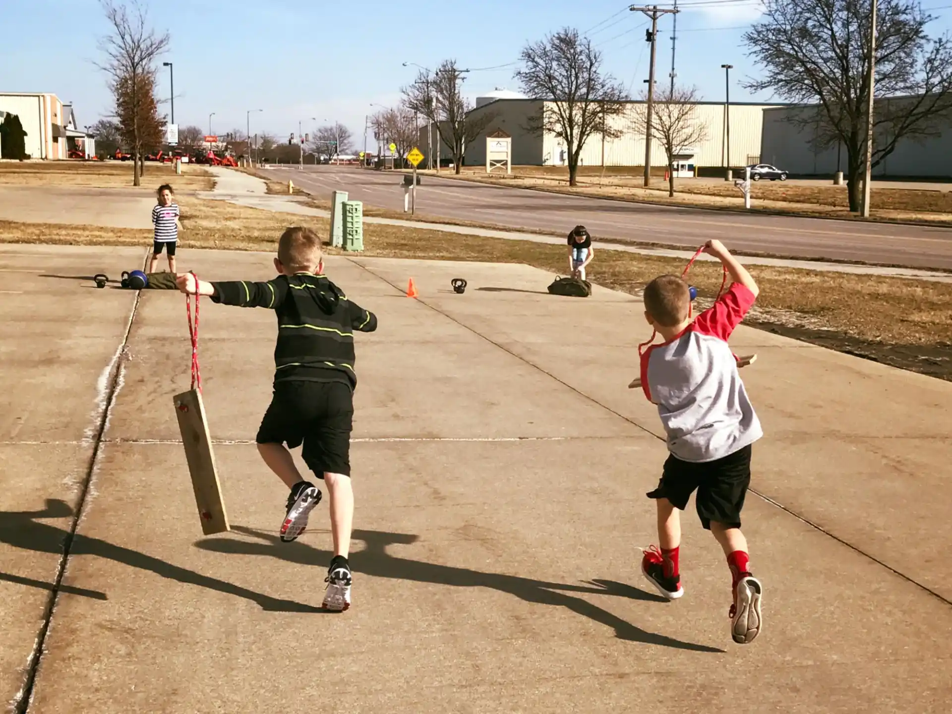 a group of kids playing with bows and arrows