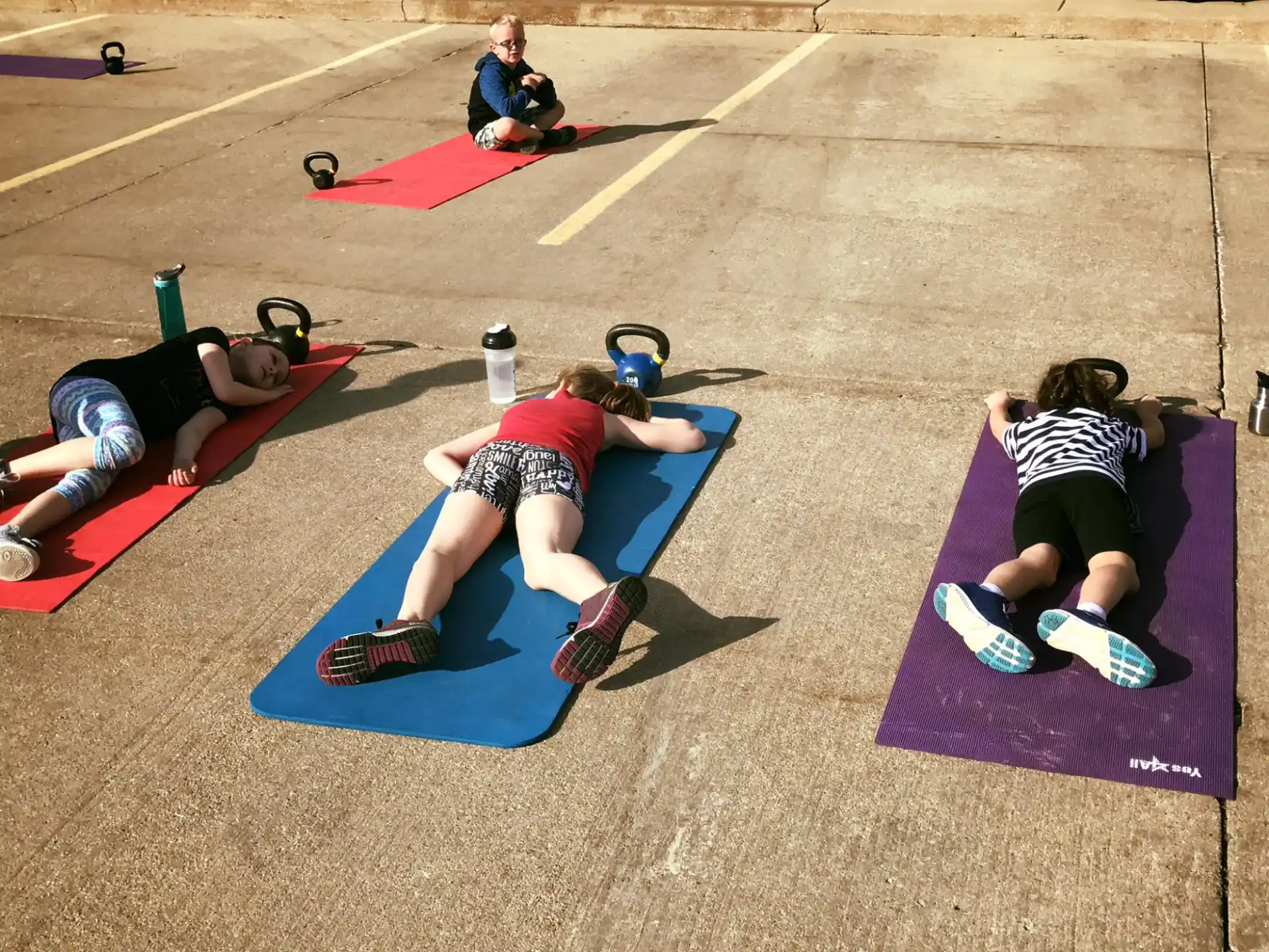 a group of people exercising on mats