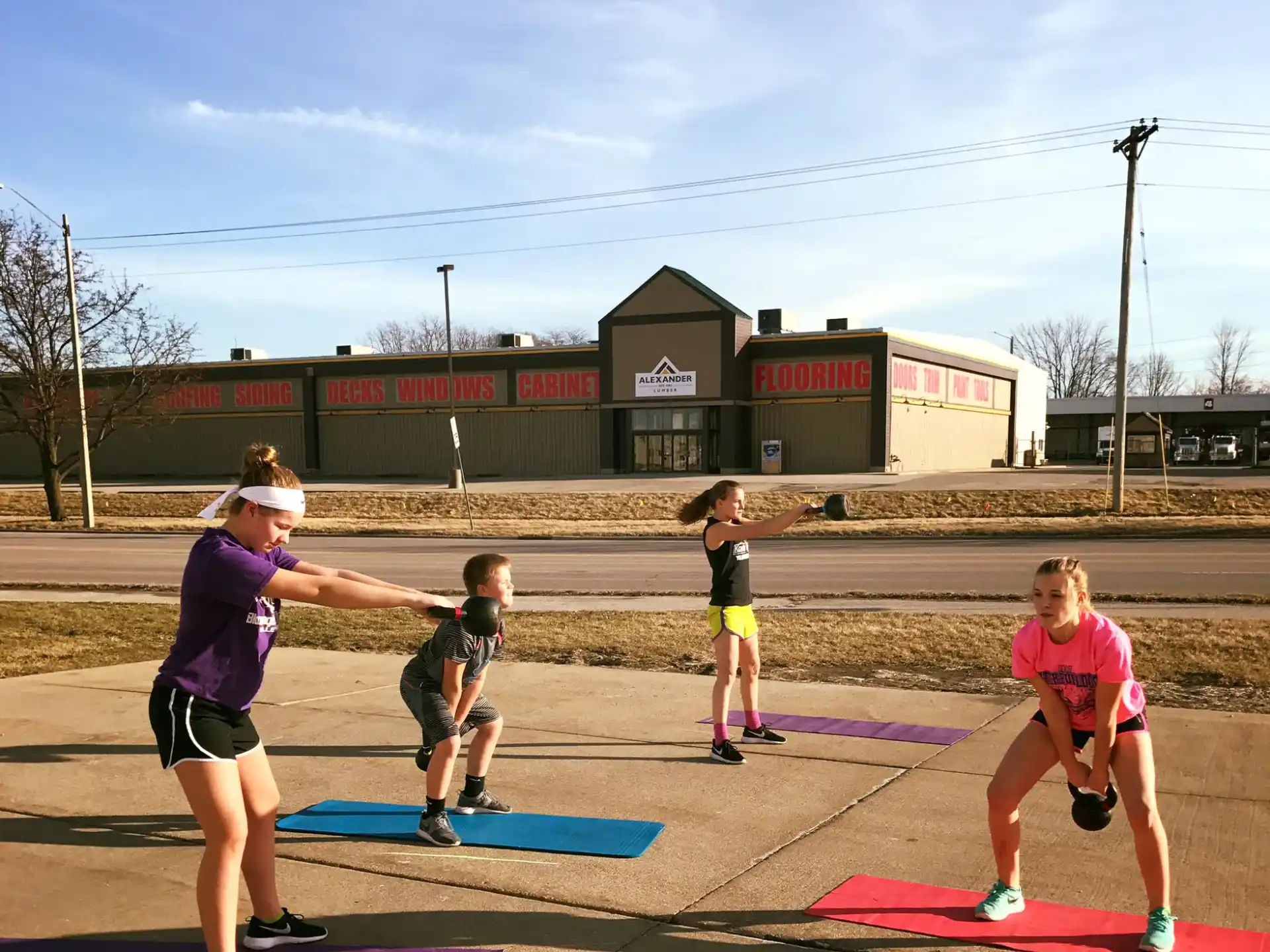 a group of people exercising outside