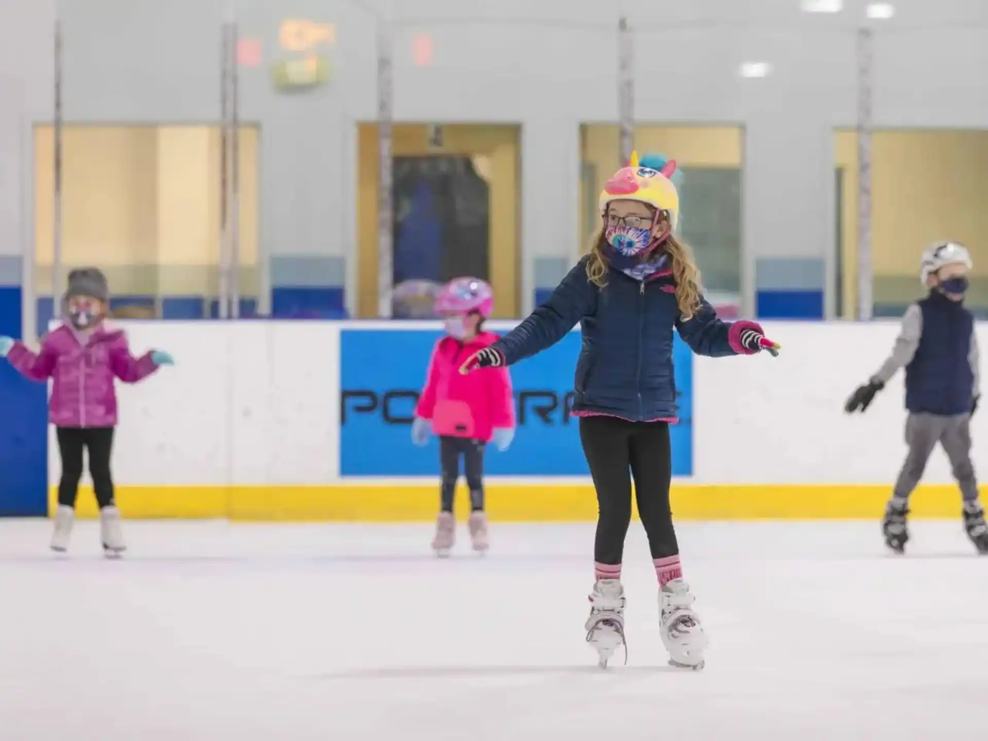 a group of people ice skating