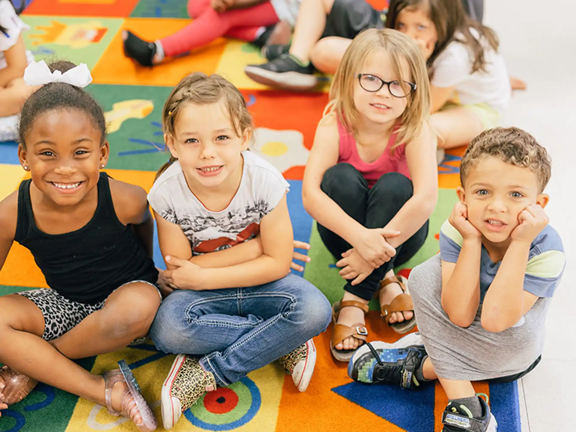 a group of children sitting on the floor