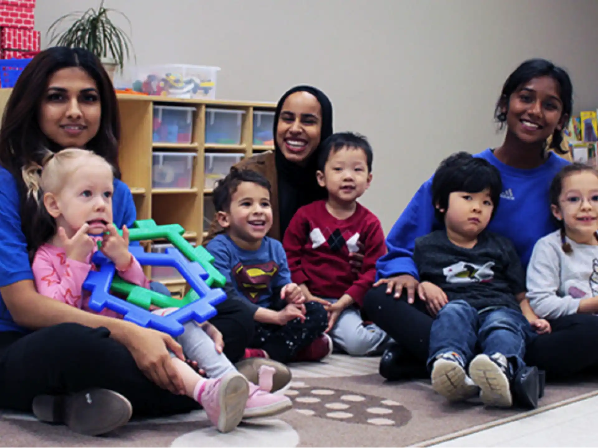 a group of children sitting on the floor