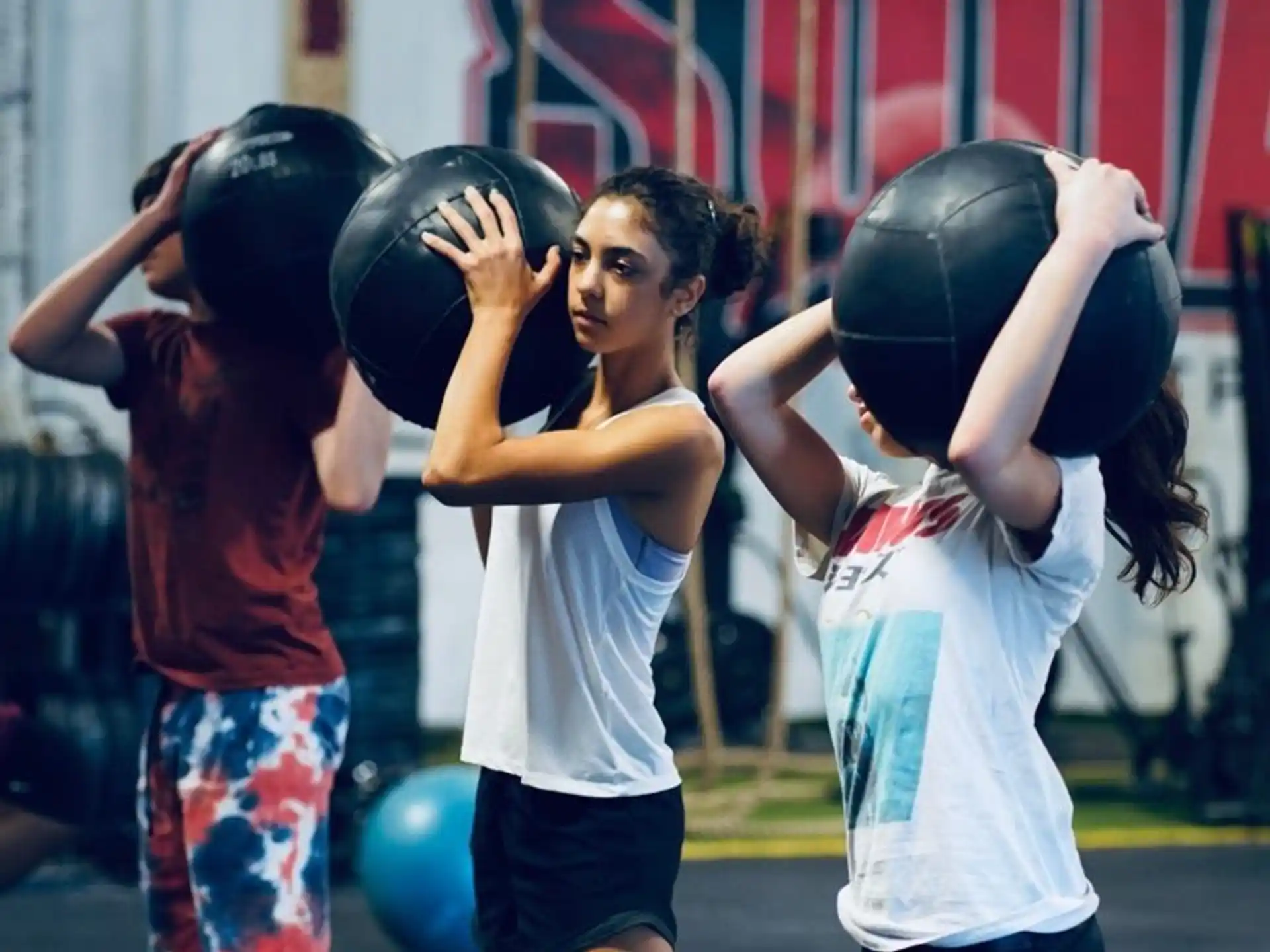a group of people lifting weights
