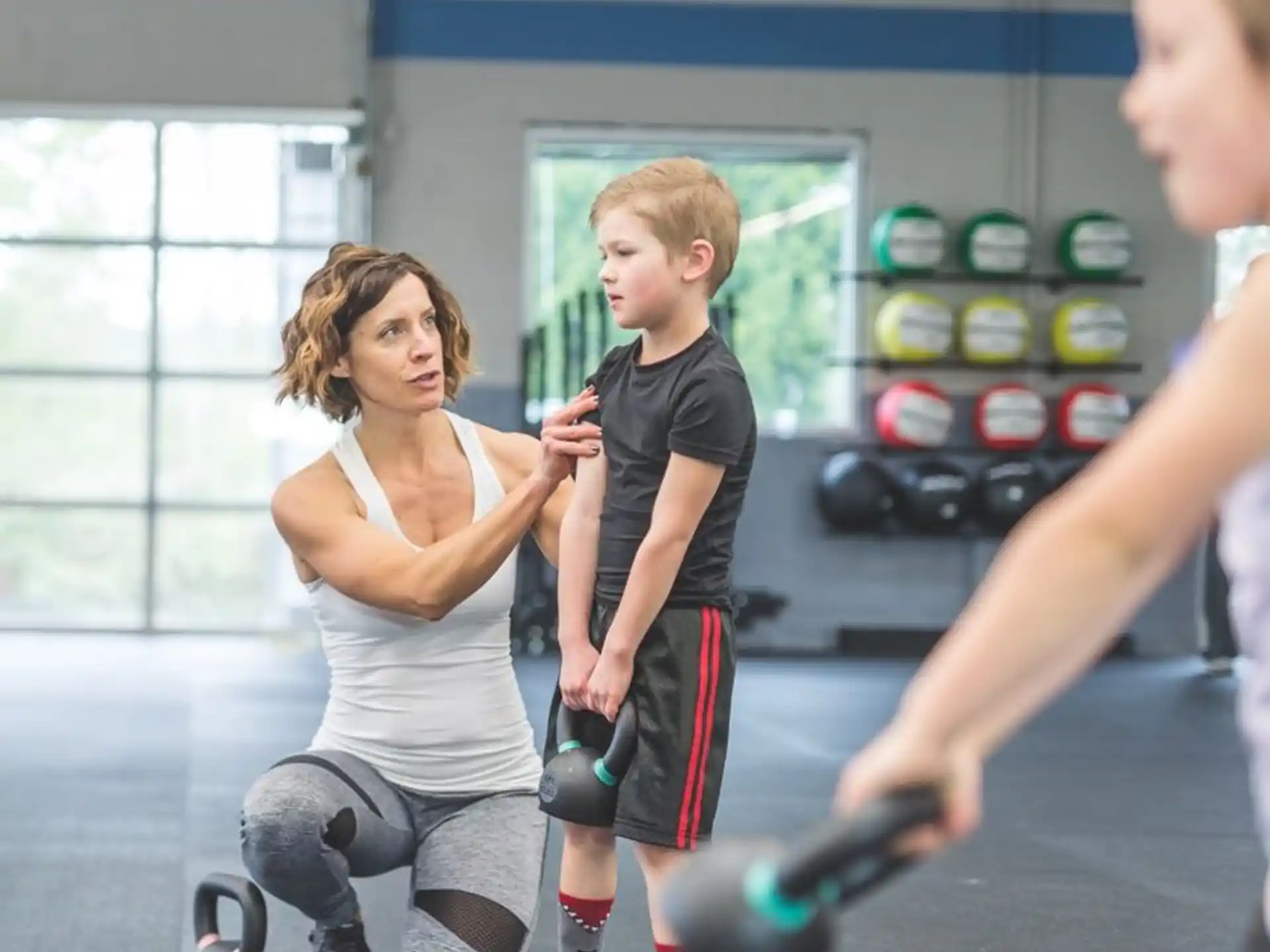 a woman and a boy exercising