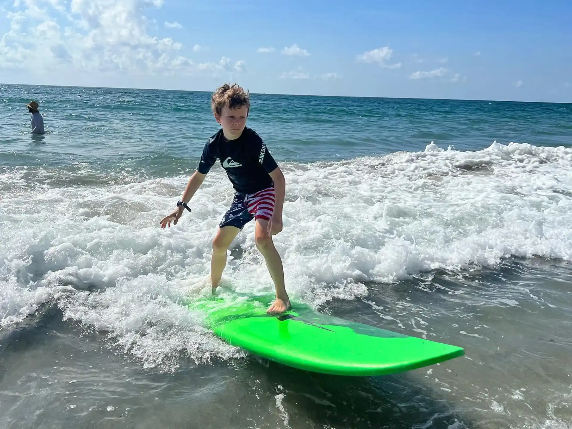a boy surfing on the waves