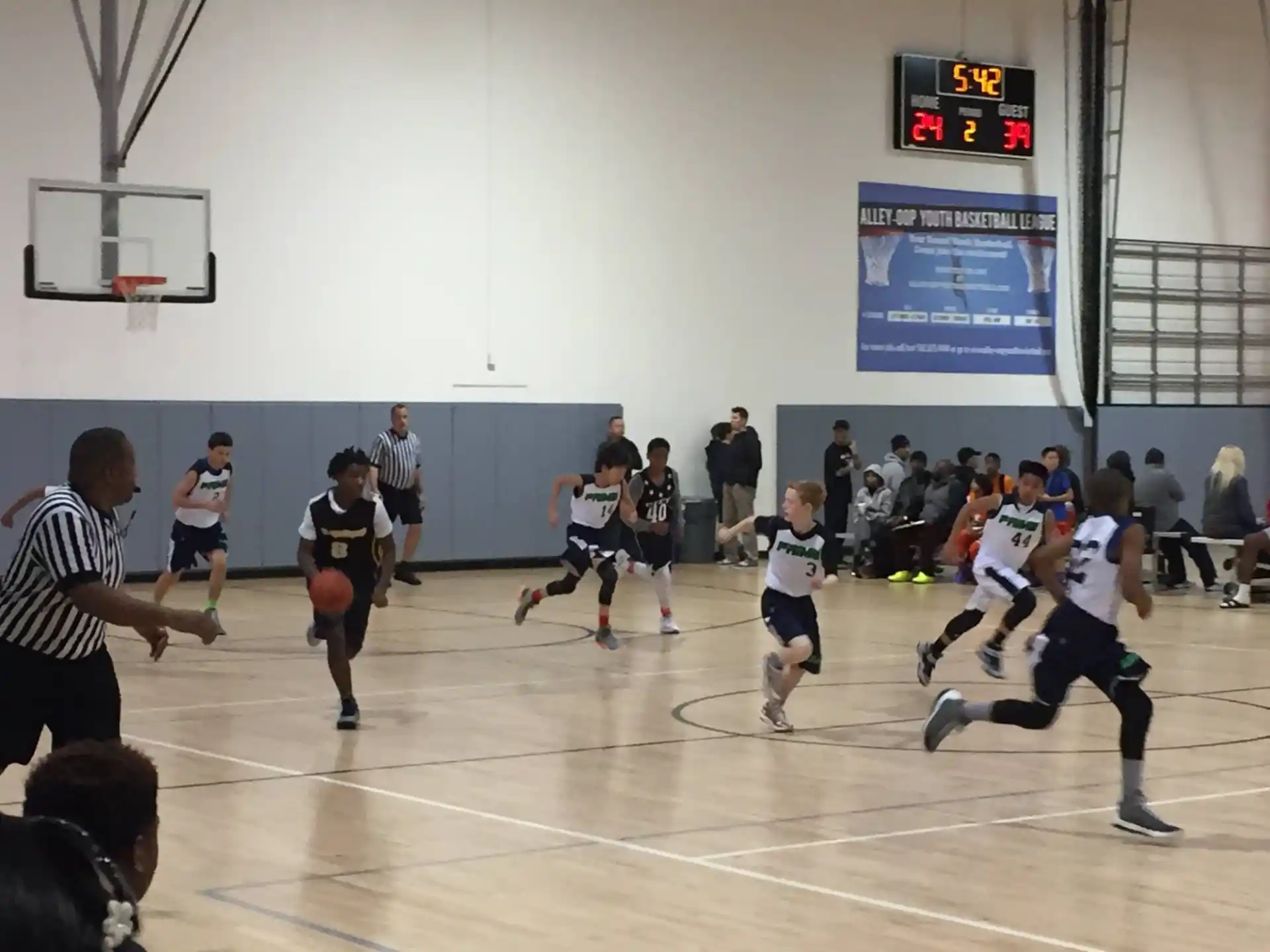 a group of people playing basketball