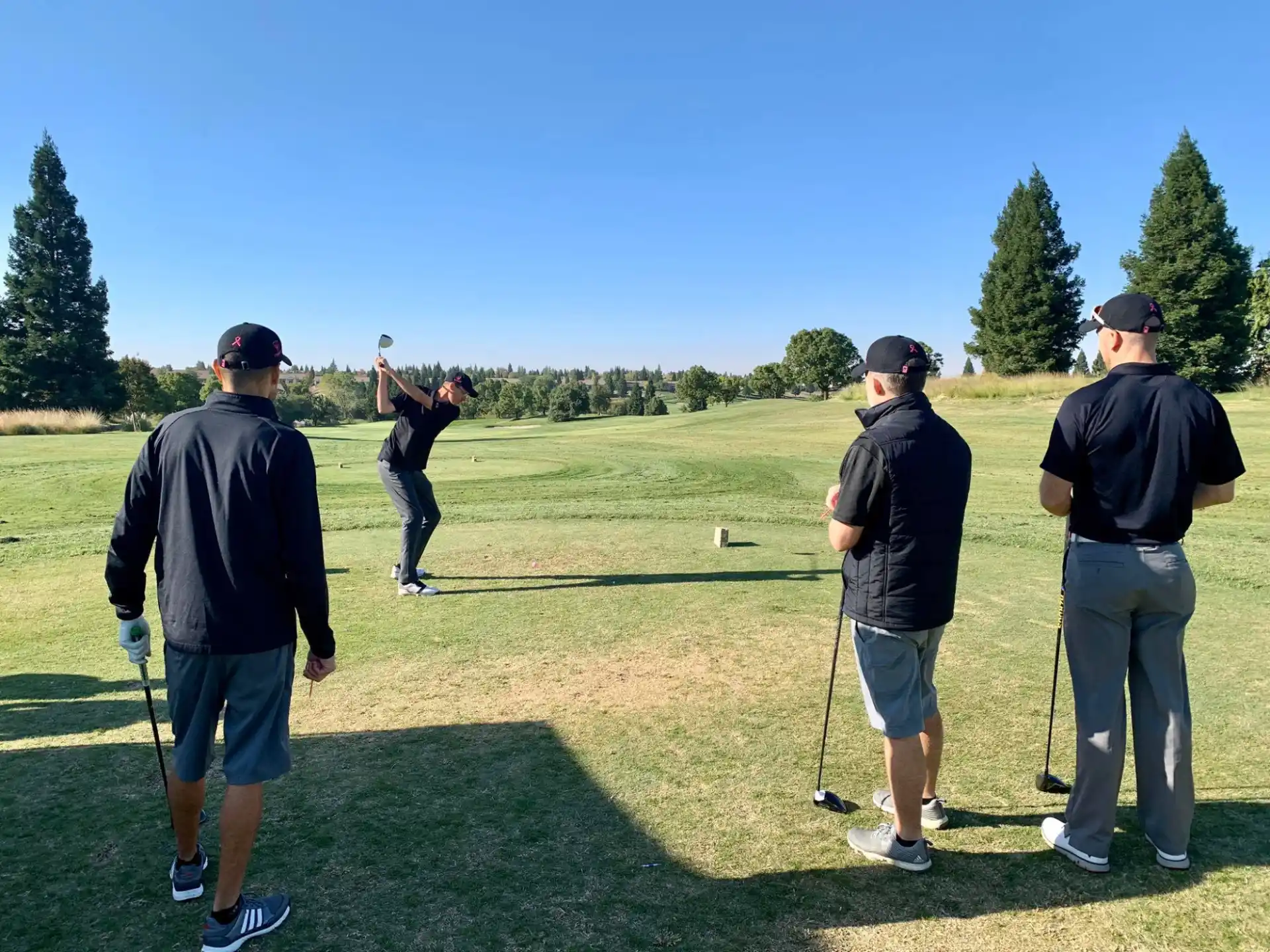 a group of people playing golf