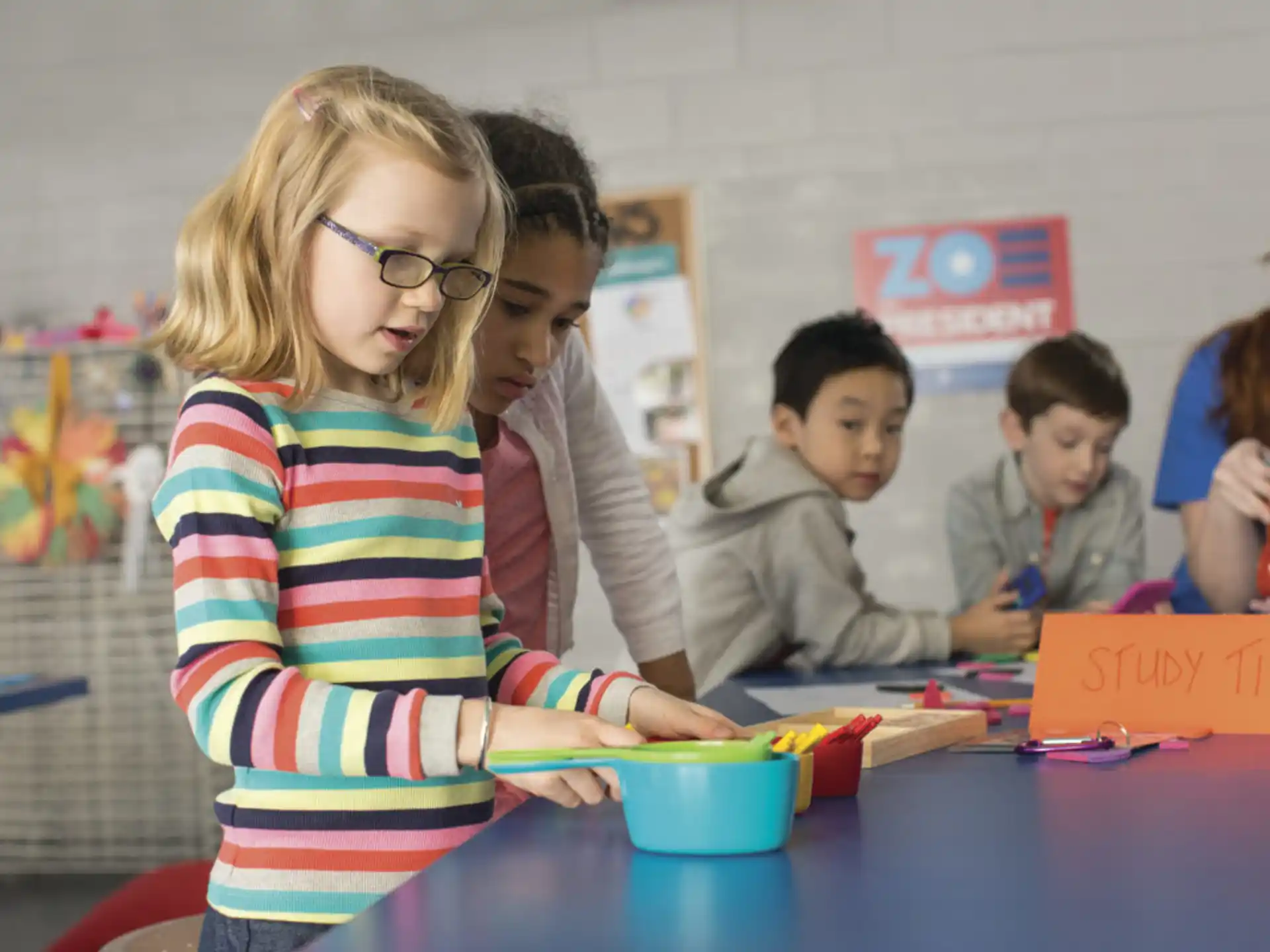 a group of children playing with toys