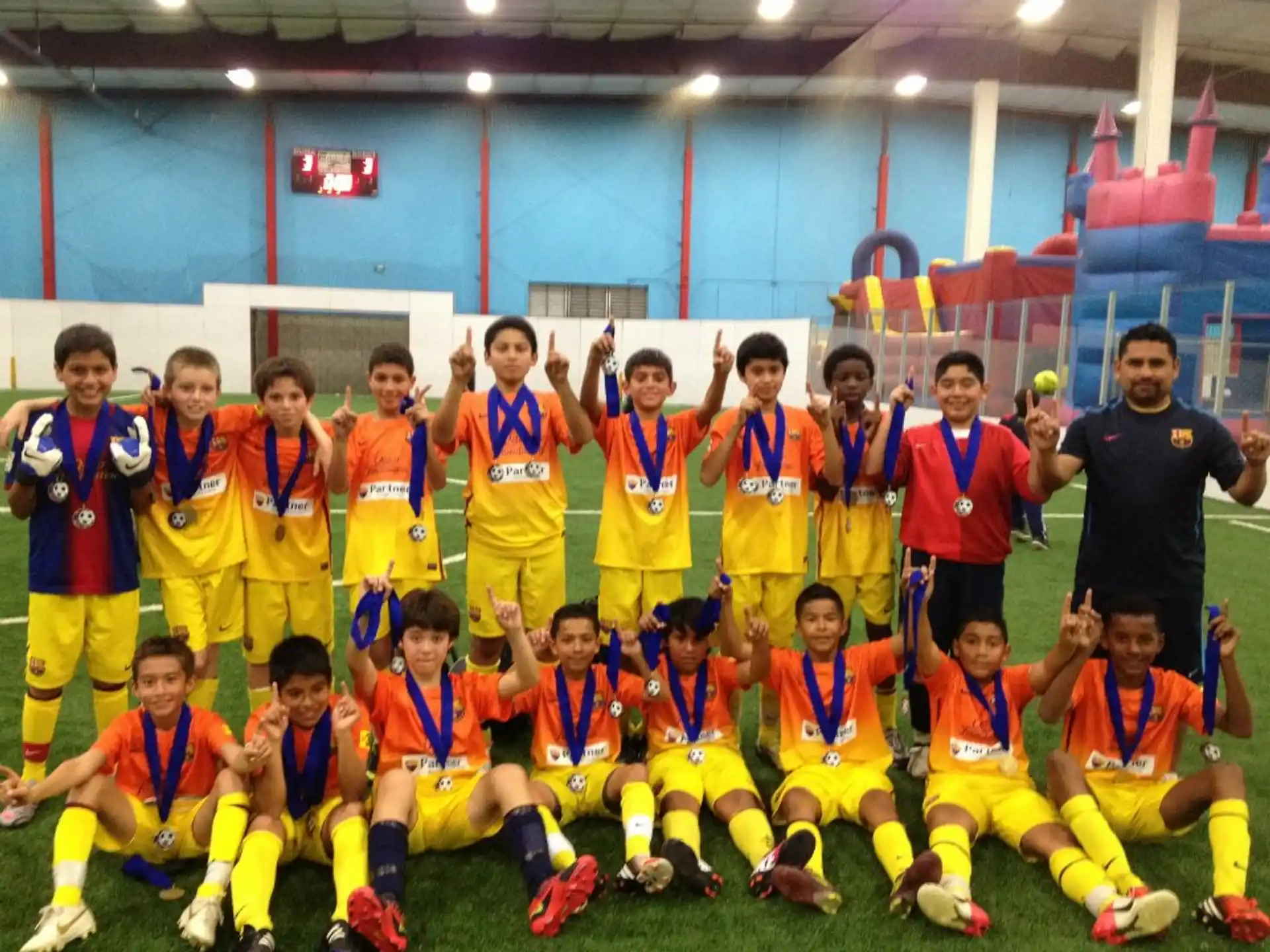 a group of football players posing for a photo