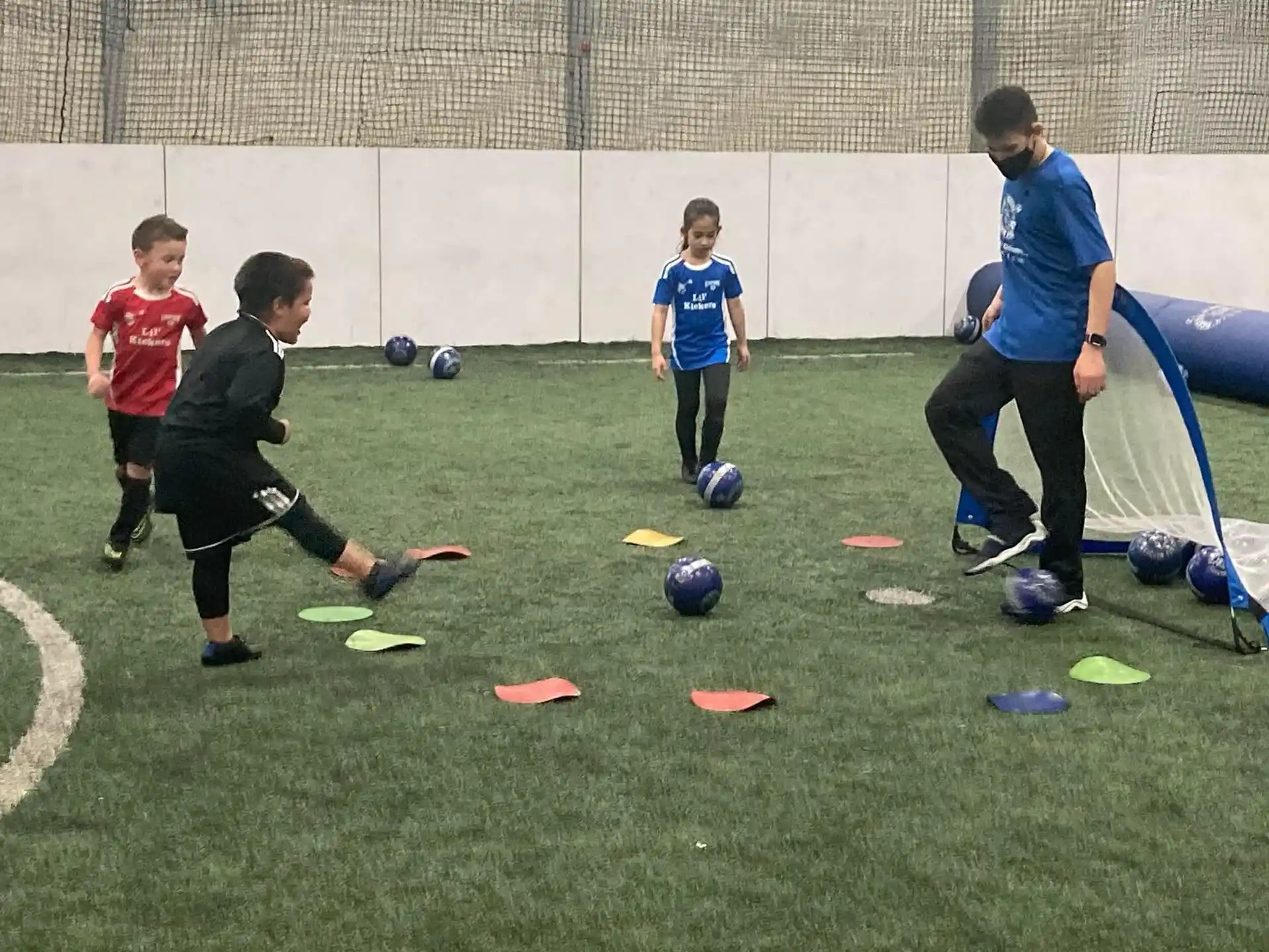 a group of kids playing football