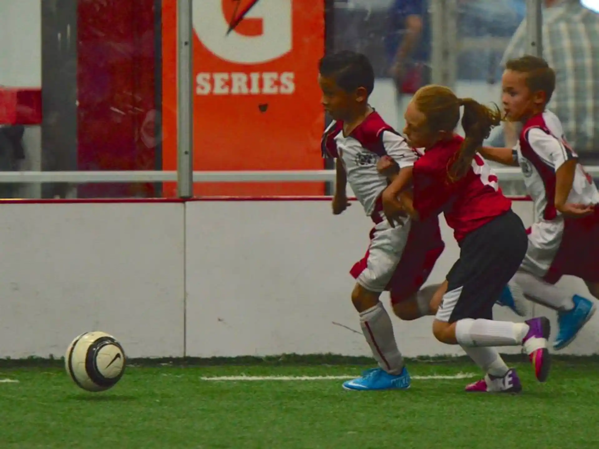 a group of kids playing football